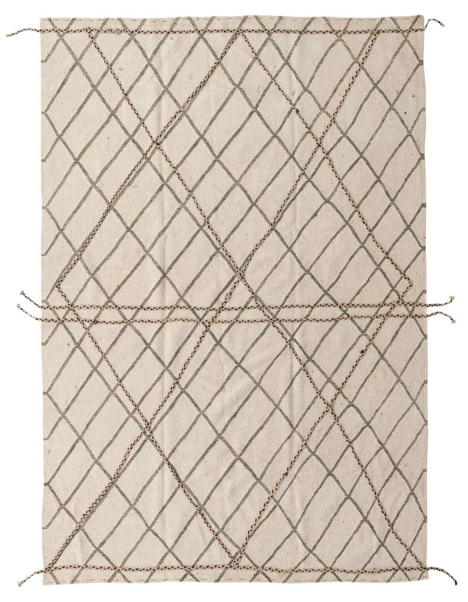 A 5x8 rectangular ivory shag rug with a brown tribal diamond pattern and braided accents, suitable for a living room.