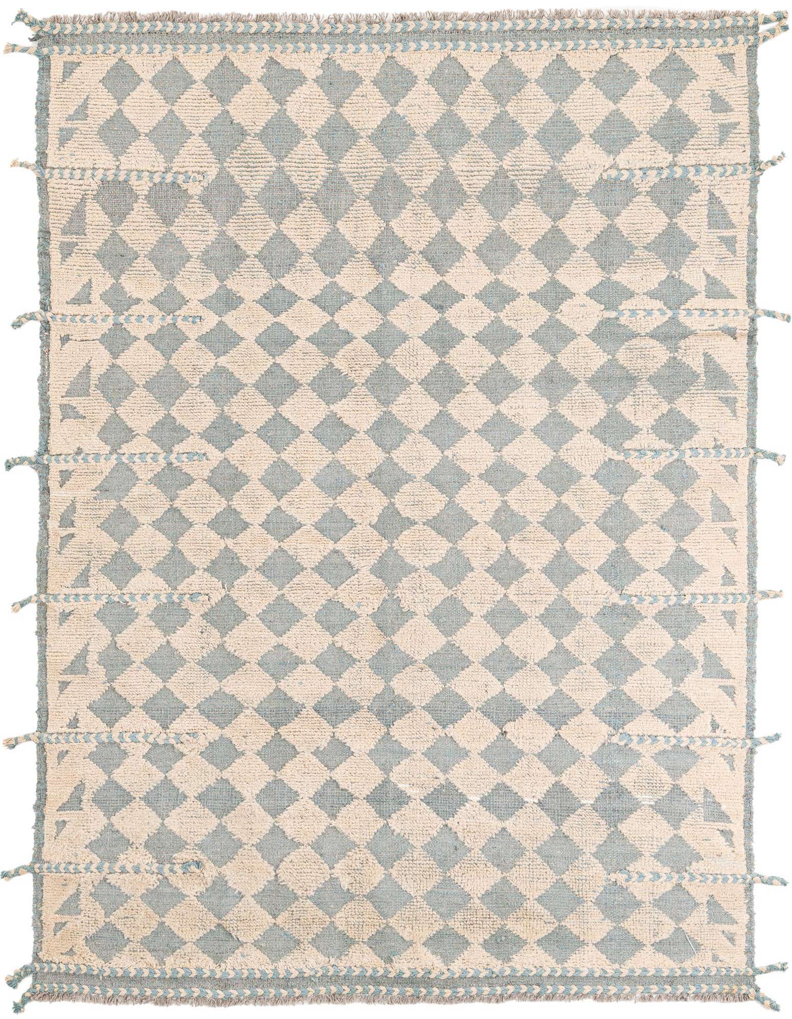 A 5x8 rectangular Moroccan shag rug with a tribal diamond pattern in light brown and cream, featuring decorative tassels.