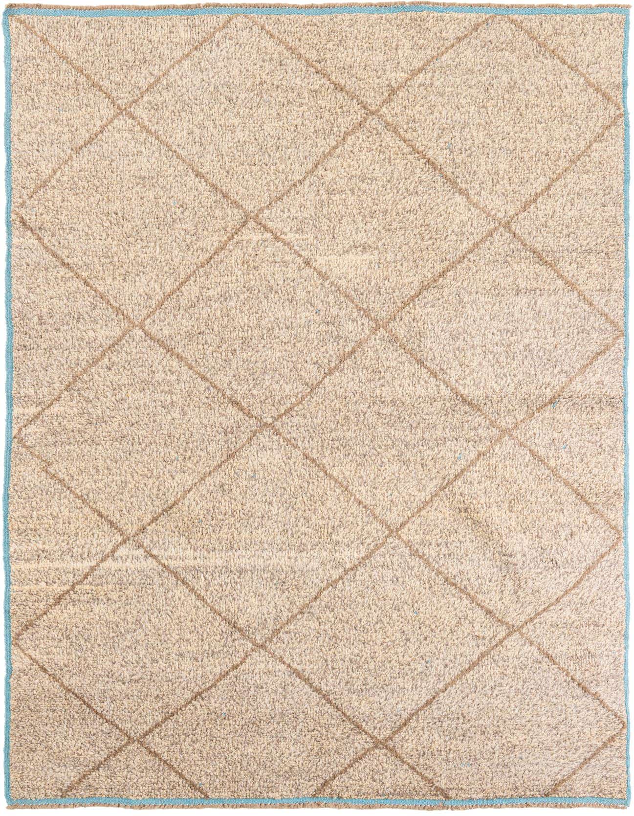 A rectangular 6x9 shag area rug in brown and ivory, featuring a tribal diamond pattern and light blue border.