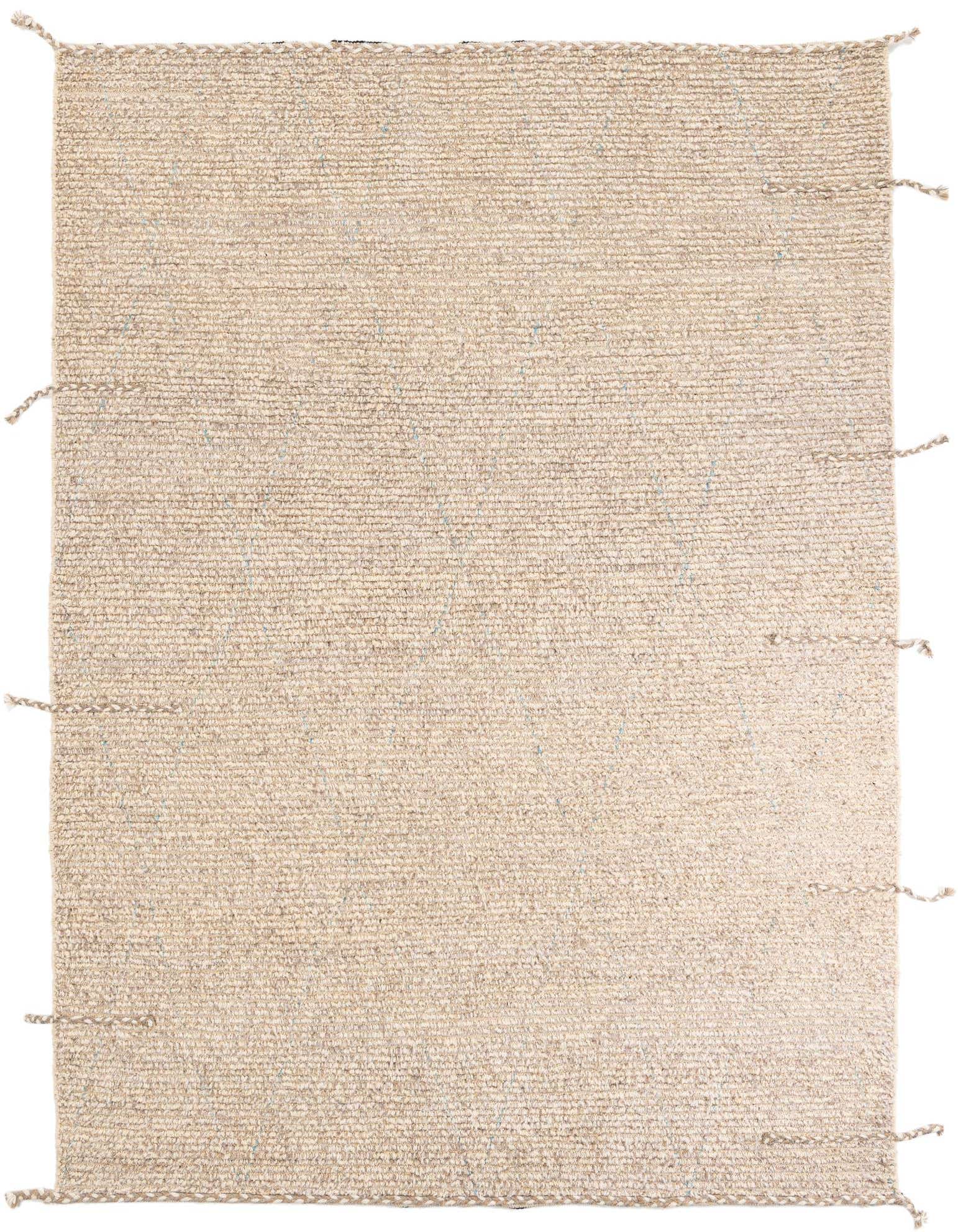 A 6x9 rectangular shag rug in natural brown and cream tones with subtle tribal patterns, suitable for a living room.