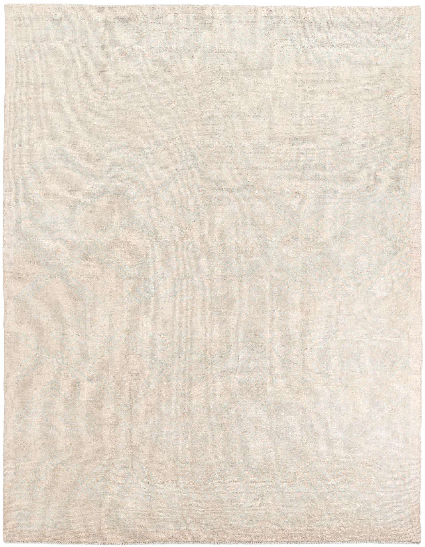 A 9x12 rectangular shag rug in warm brown and ivory tones with a subtle tribal pattern, perfect for a modern living room.