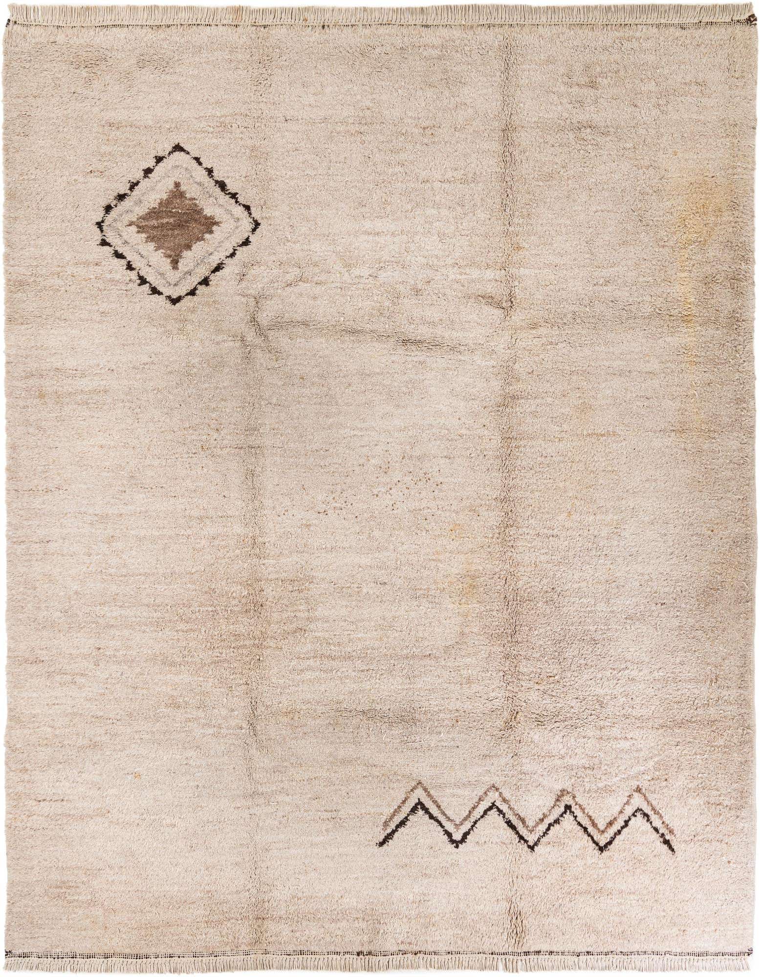 A rectangular 8x10 Moroccan shag rug in cream with a brown tribal diamond and zigzag pattern.