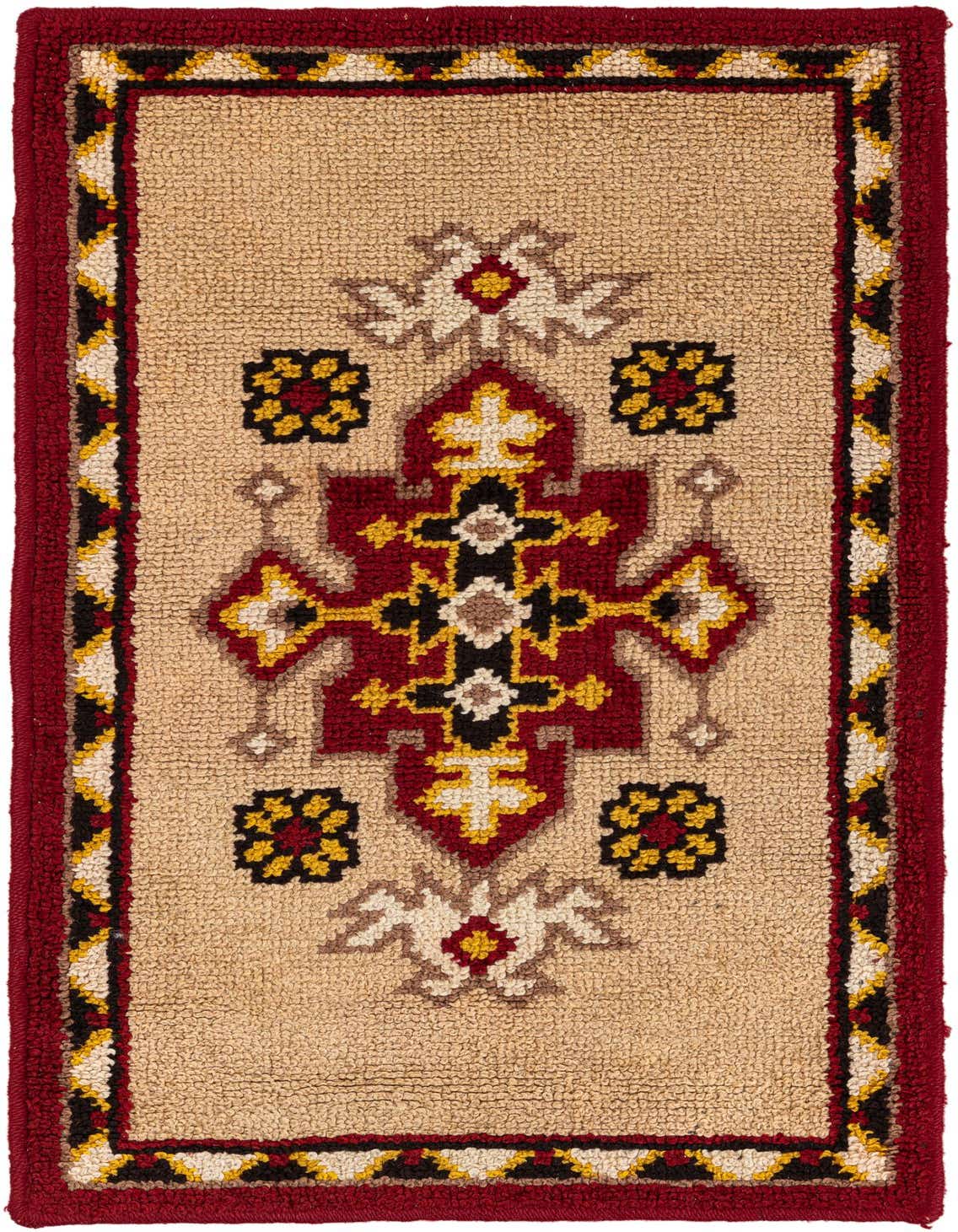 A 3x5 rectangular Moroccan shag rug with a central tribal medallion in red, black, and yellow on a tan background, framed by a red border.