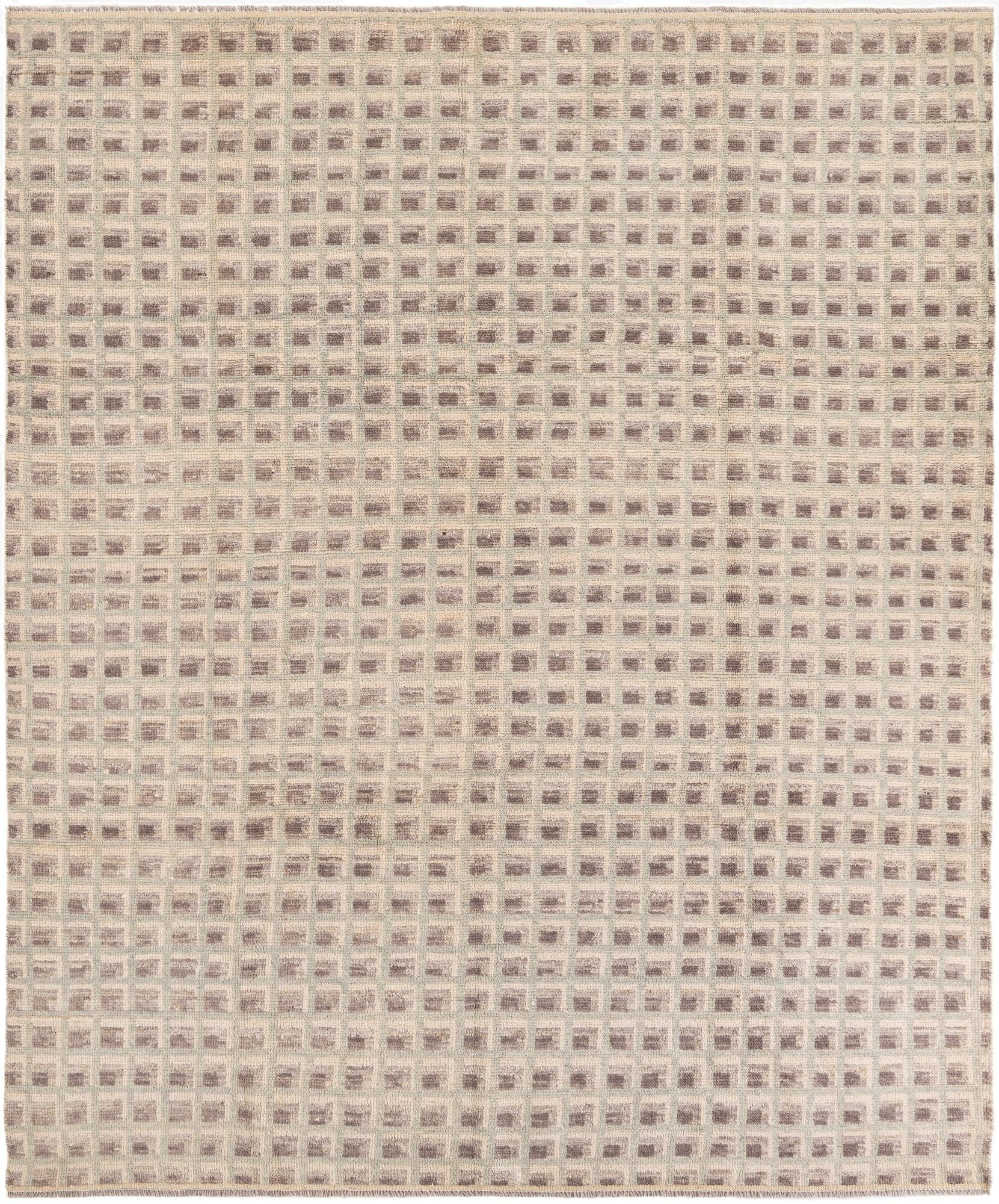 An 8x10 rectangular shag rug with a modern tribal pattern in shades of brown, tan, and cream.