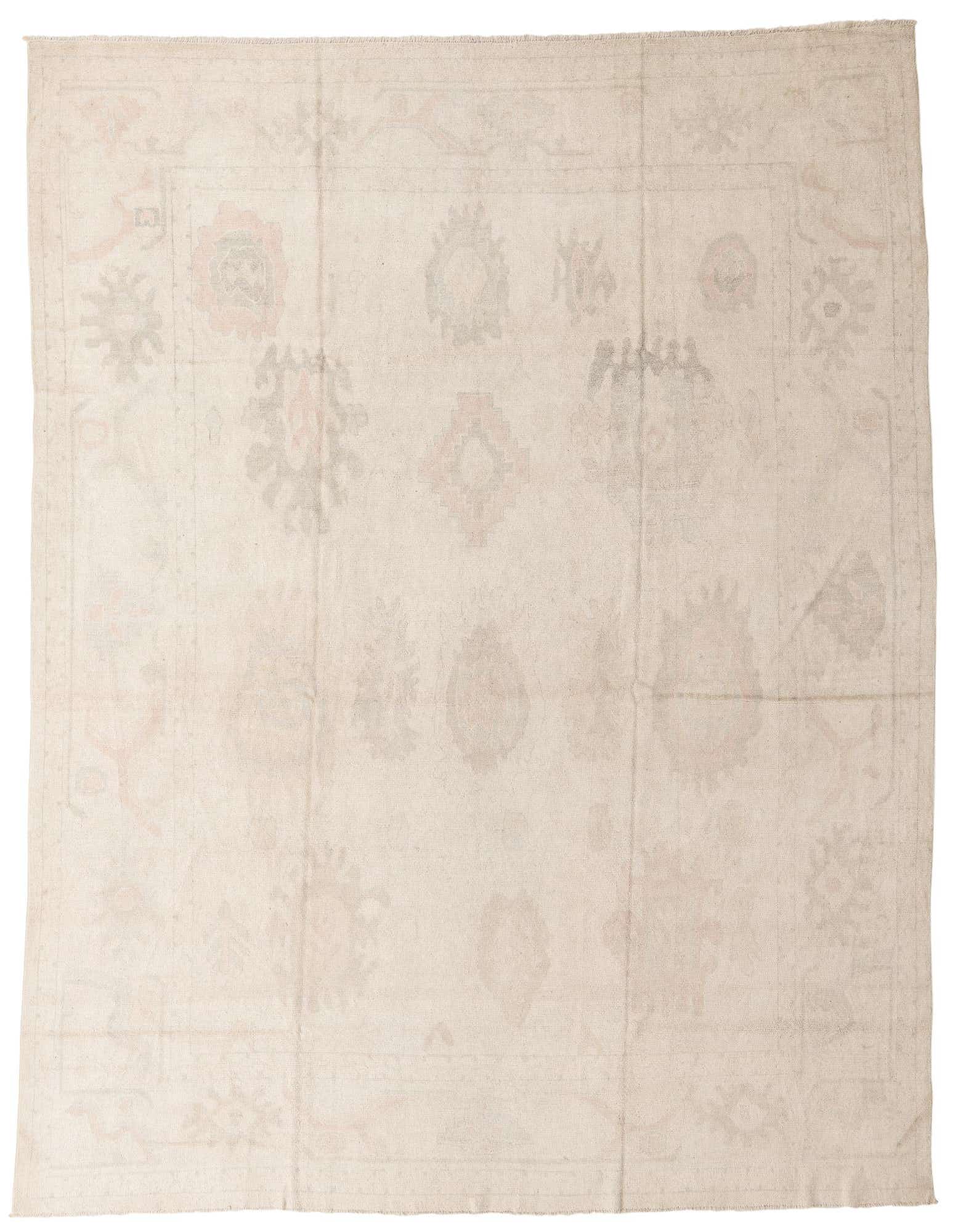 A 10x13 rectangular Oushak rug in shades of brown and ivory, featuring a subtle border pattern, ideal for a living room.