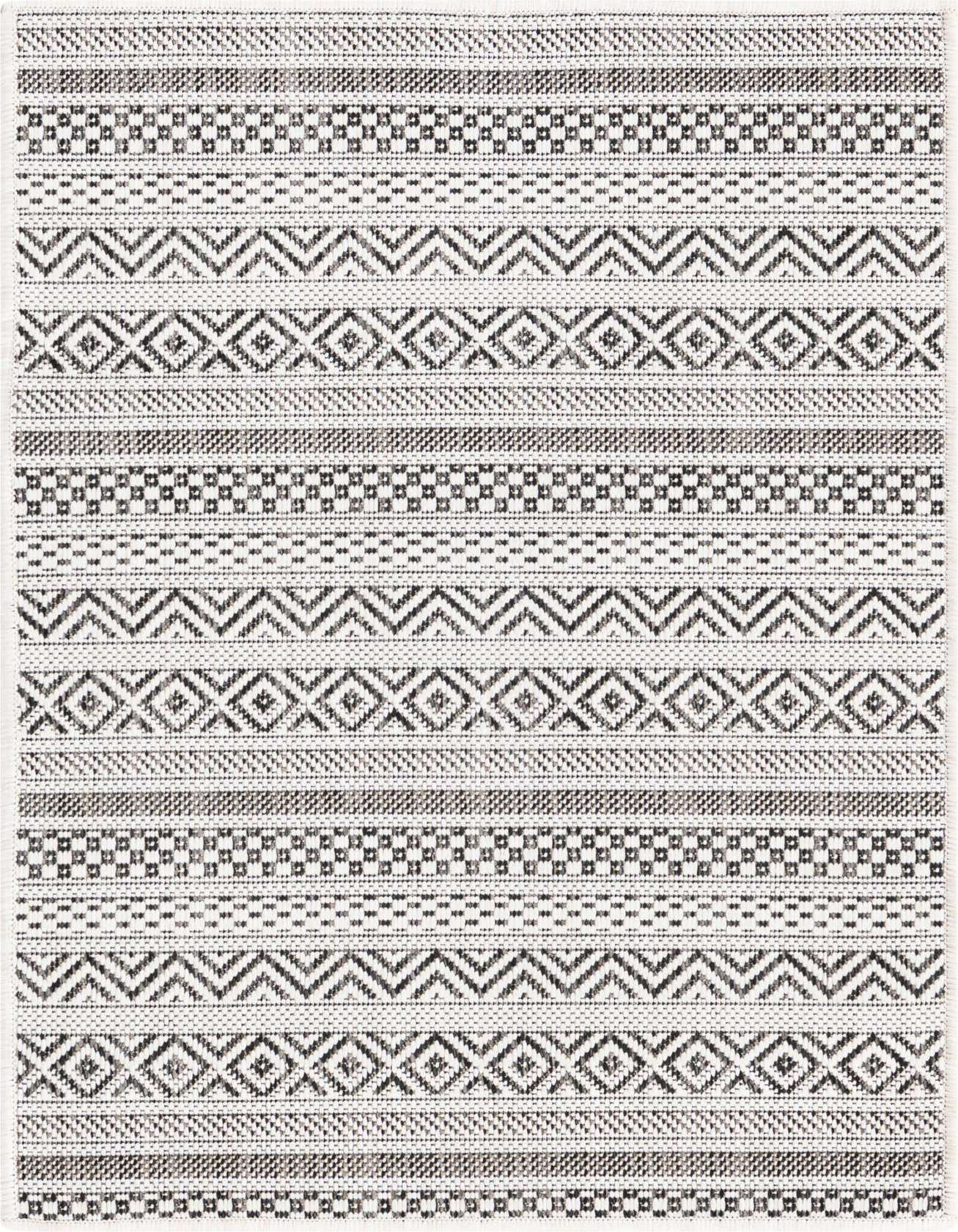 A 2x3 rectangular Rugs.com Outdoor Ribbon rug featuring a tribal pattern in browns, tans, and ivories.