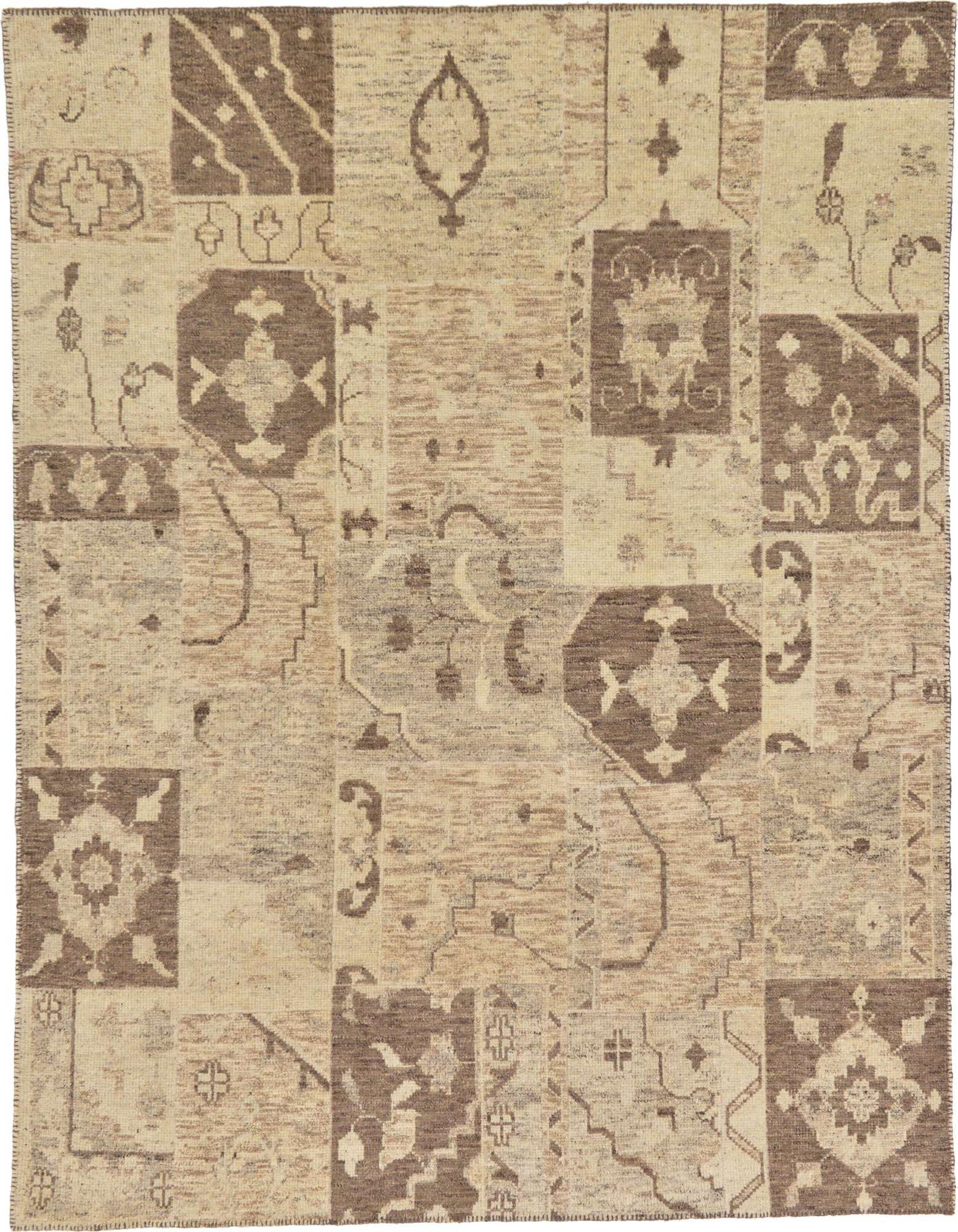 A rectangular 8x10 Rugs.com Patchwork rug featuring a mosaic of modern and oriental patterns in browns, tans, and ivories.