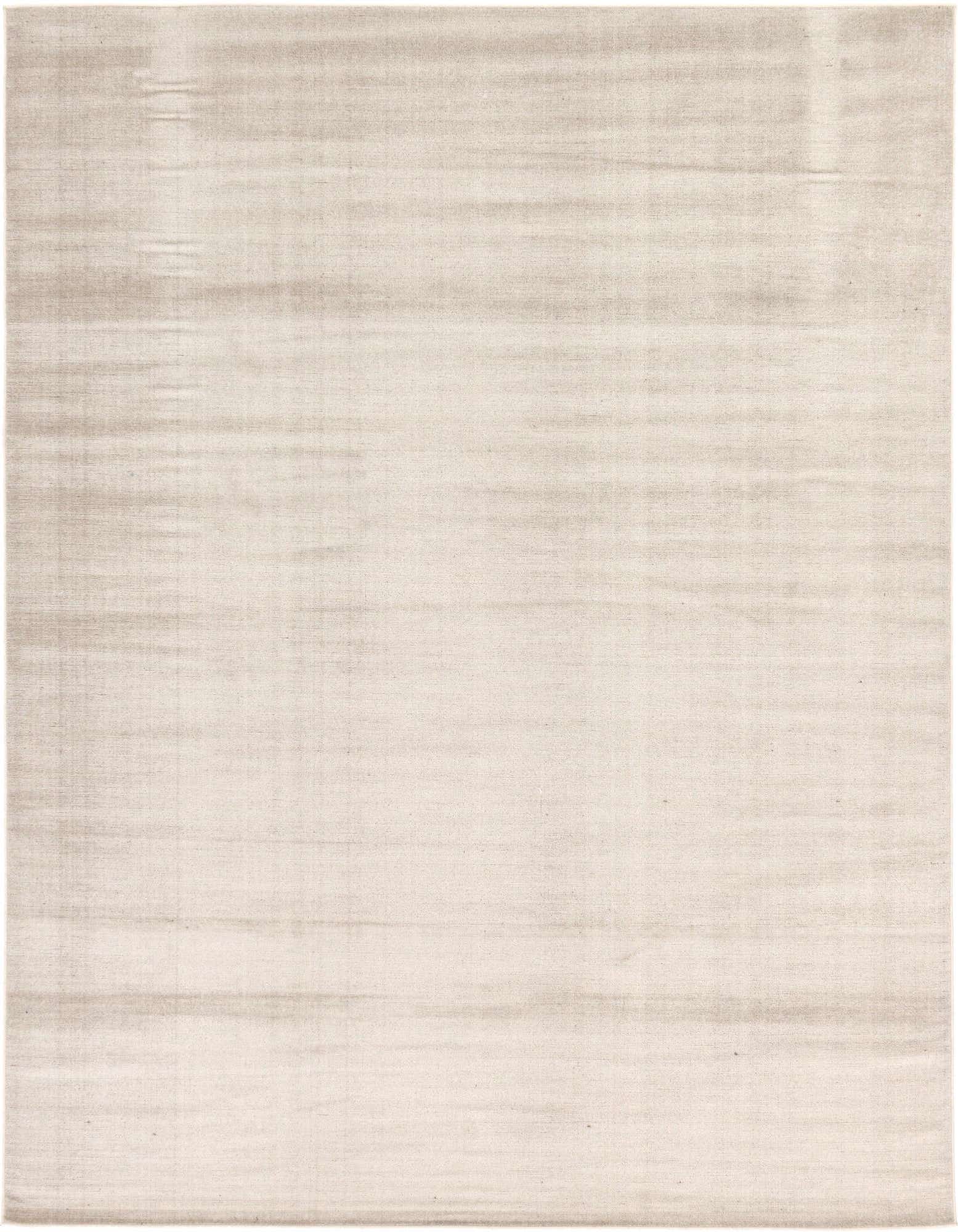 An 8x10 rectangular SoHo rug in varying shades of brown and tan, featuring a subtle, flat-pile, transitional design.