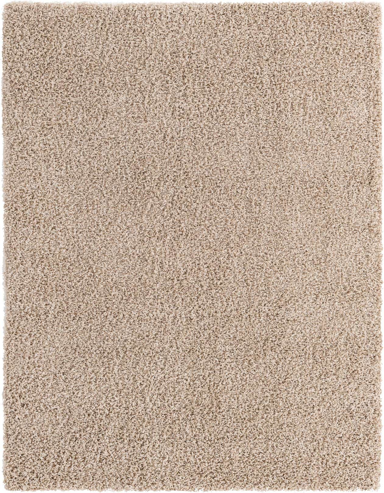 A close-up view of a 5x8 rectangular Solid Shag rug in a blend of brown, tan, and cream colors, showcasing its plush, textured pile.