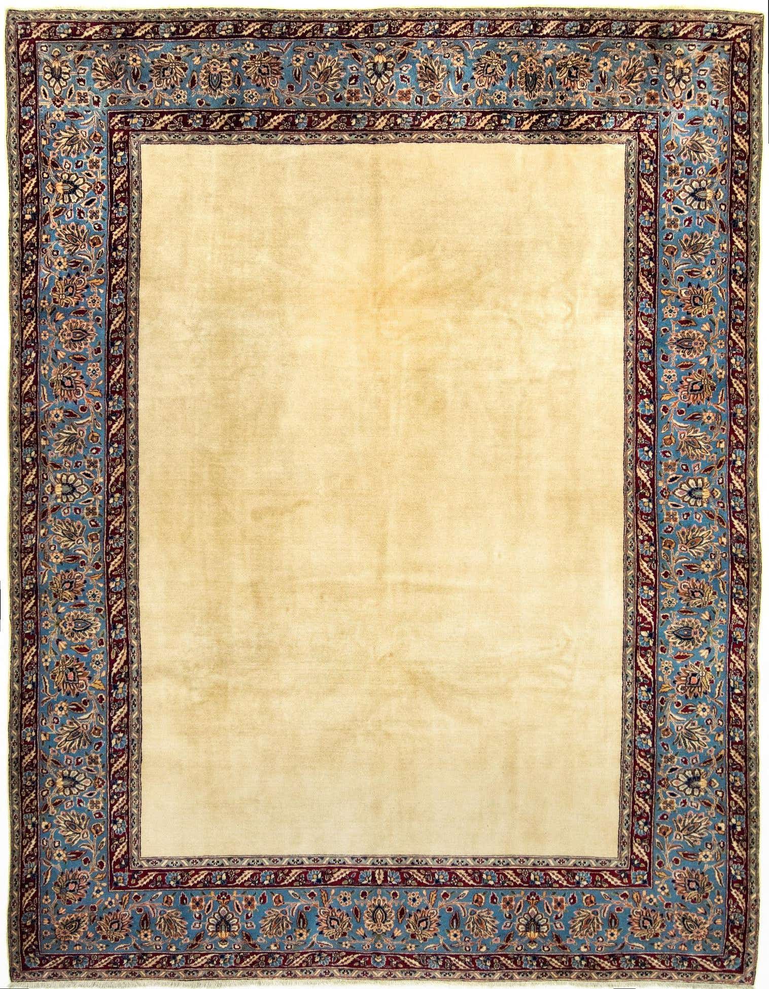 A 7x10 rectangular Tabriz rug featuring a cream field and an ornate blue and brown Persian border.