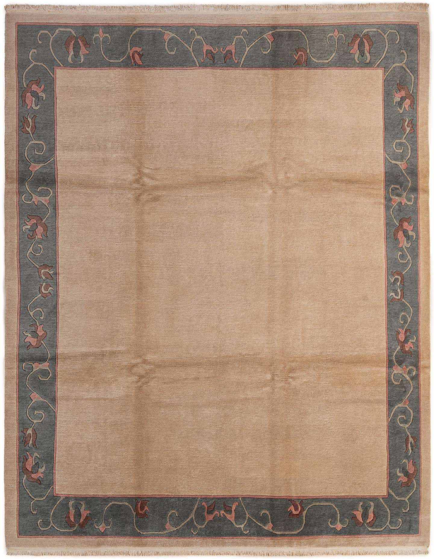 8x11 rectangular modern wool rug with a tan field and a dark teal border featuring pink and brown floral motifs.
