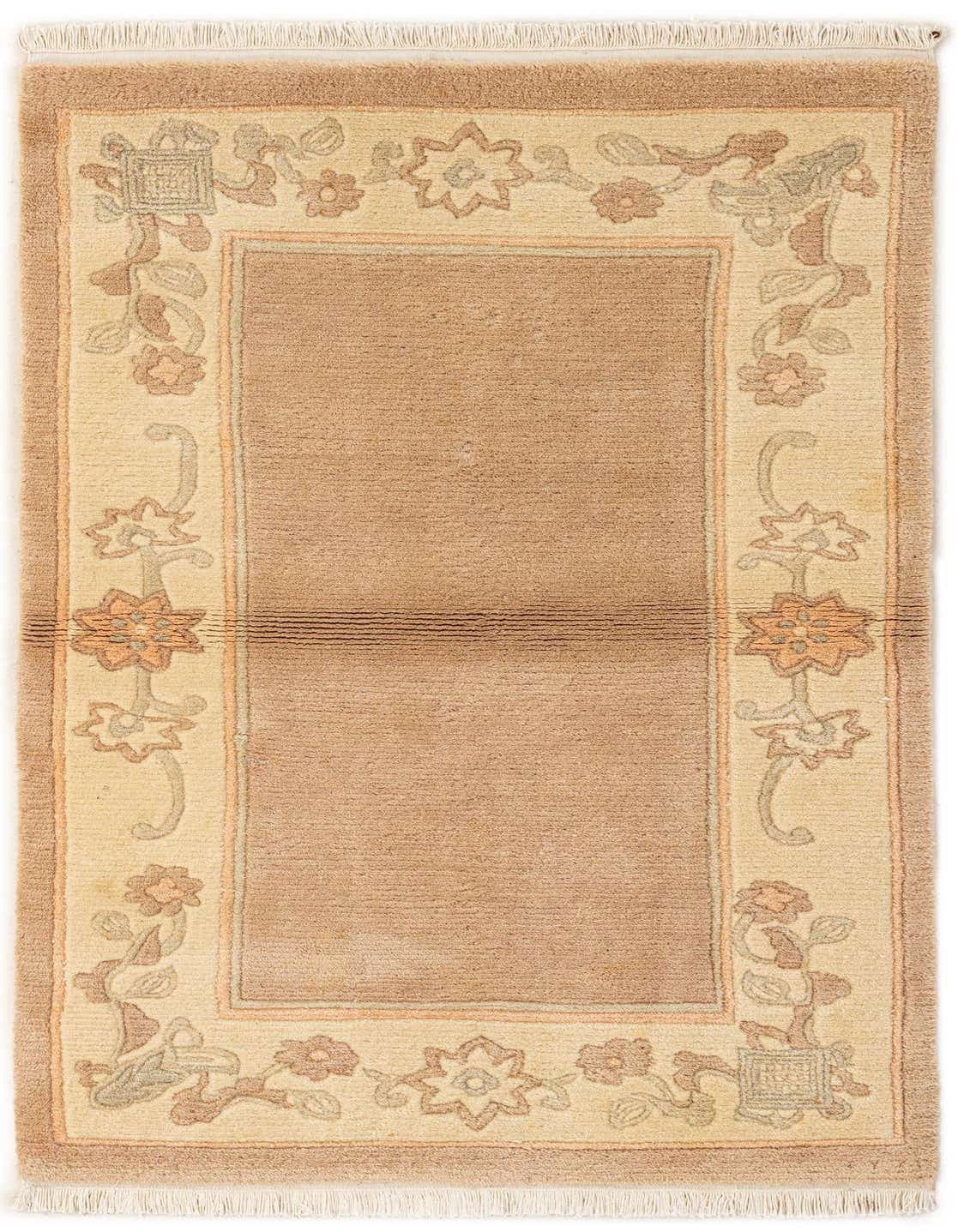 A 3x5 rectangular brown wool rug with an ivory border featuring a delicate floral and vine pattern in subtle tan and cream tones.