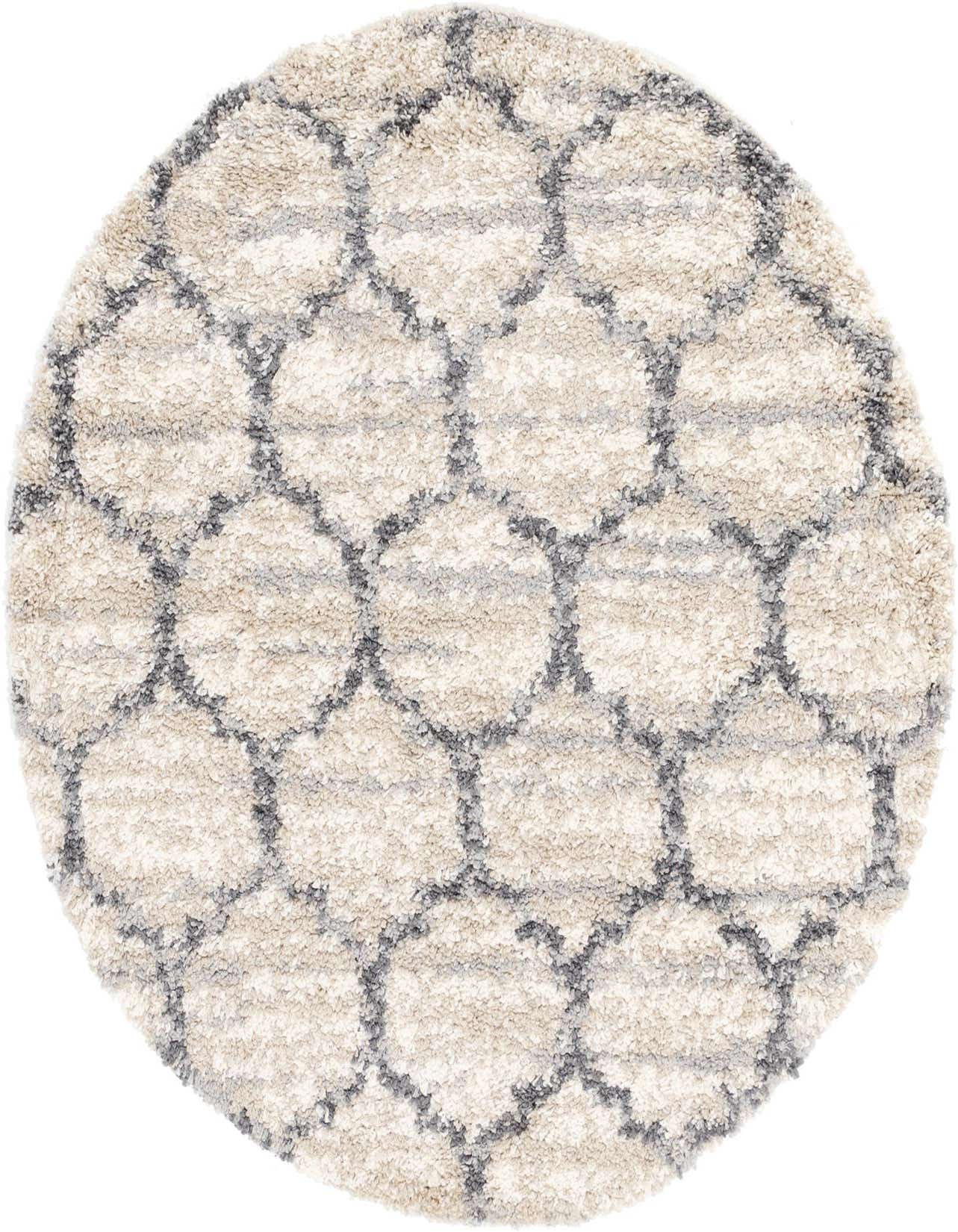 A round, shag rug with a cream and tan base featuring a subtle gray abstract geometric pattern, perfect for a cozy living space.