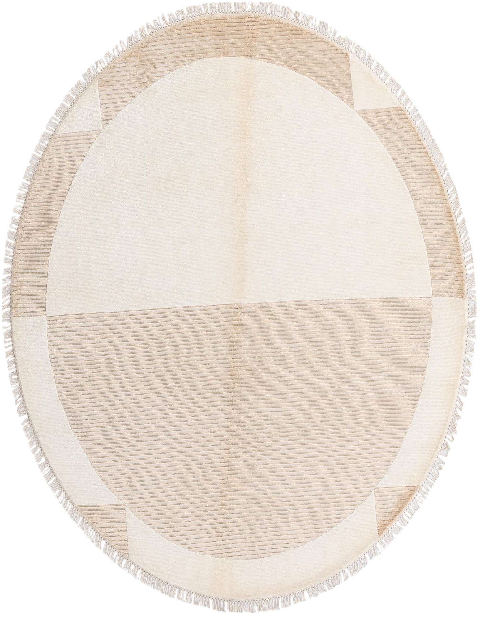 A round 6' 6 x 6' 6 Darya rug with a modern oriental pattern in cream and tan, featuring a high pile and fringed edges.