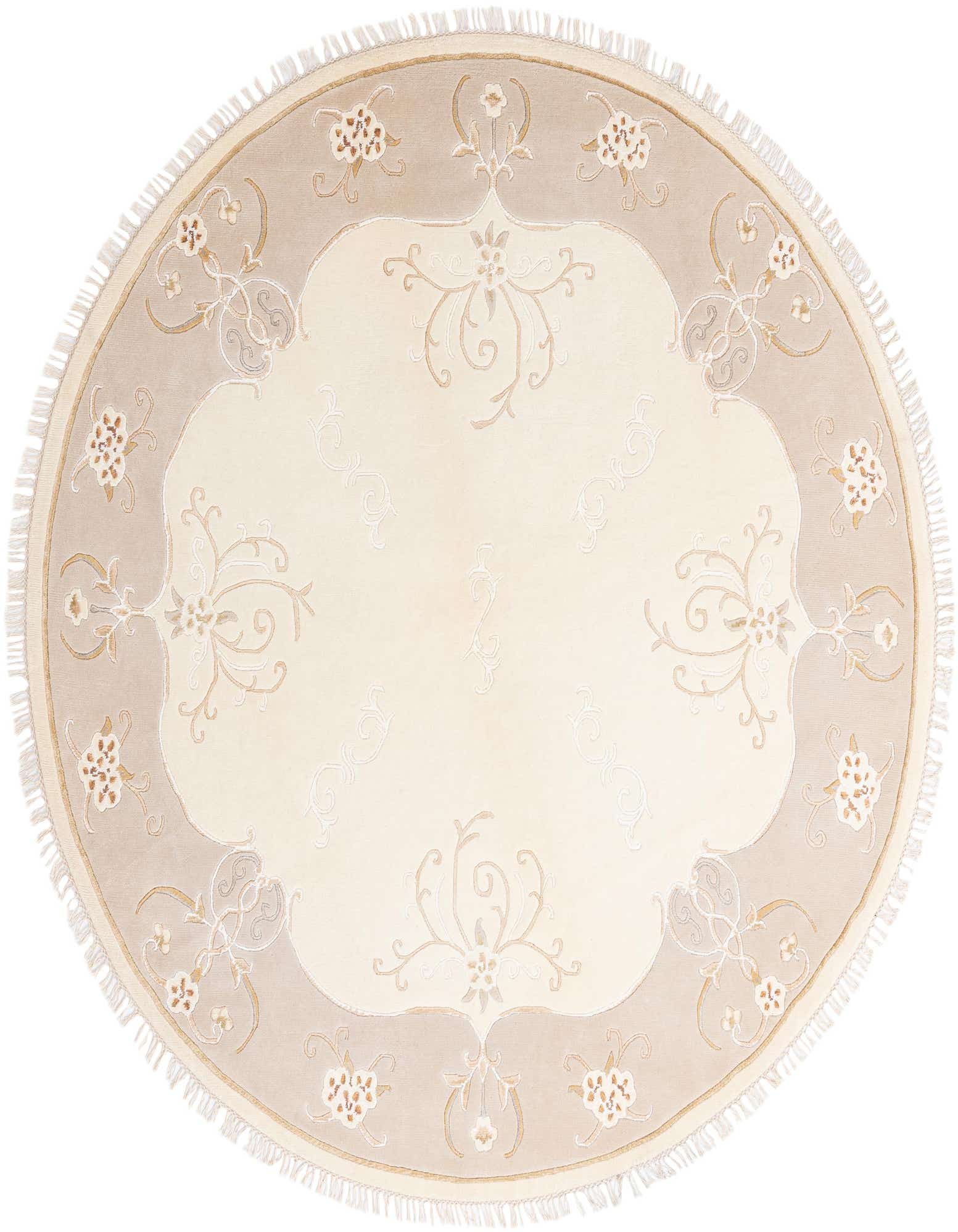 A round, high-pile Darya rug in cream and tan with an ornate floral and scroll pattern, featuring delicate fringe.