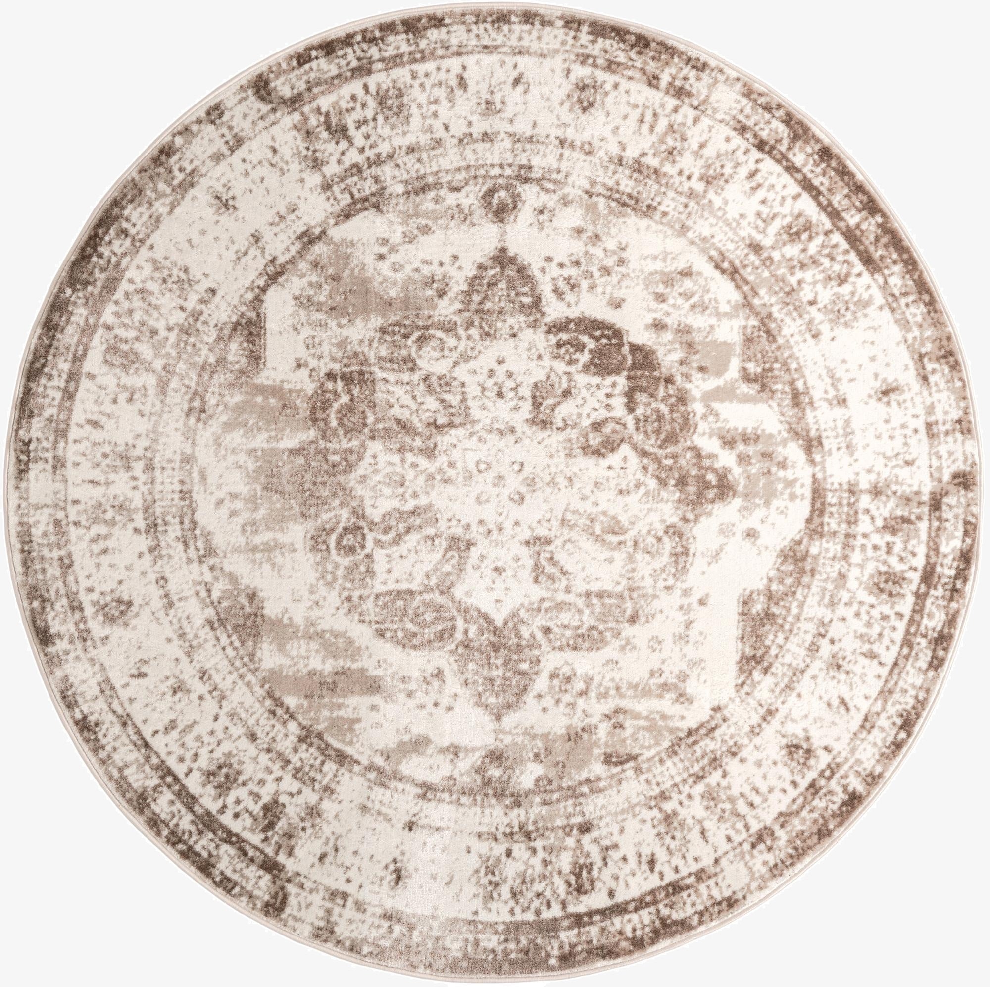 A 7' 10 round Monte Carlo rug featuring a distressed medallion pattern in browns, tans, and ivories.