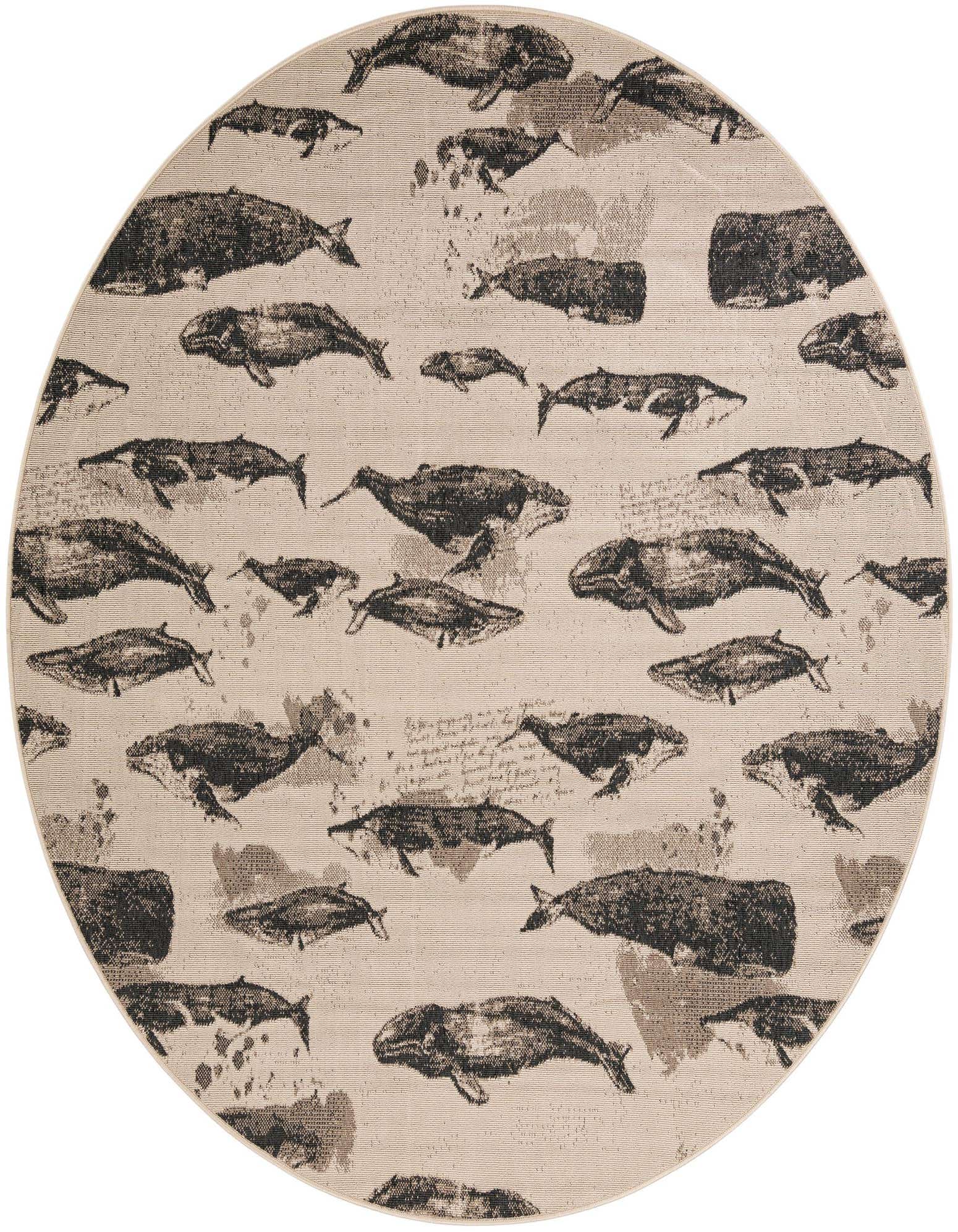 A round, flatweave rug with a modern whale pattern in shades of brown and tan on an ivory background.