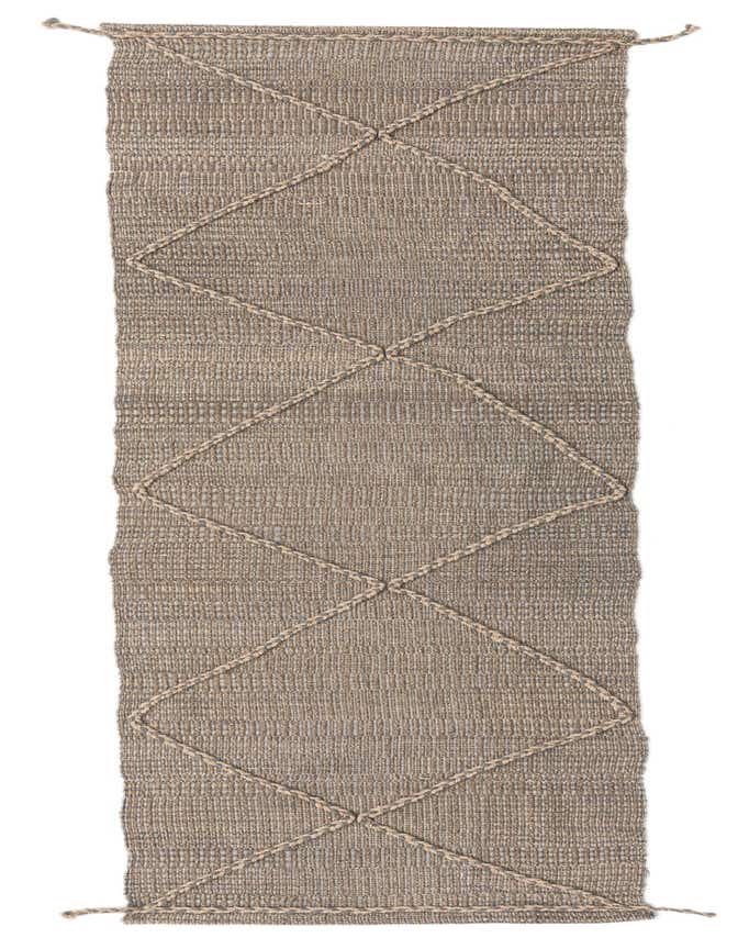 A 10 ft Darya runner rug by Rugs.com, featuring a brown and tan woven wool texture with a cream geometric diamond pattern, perfect for a hallway.