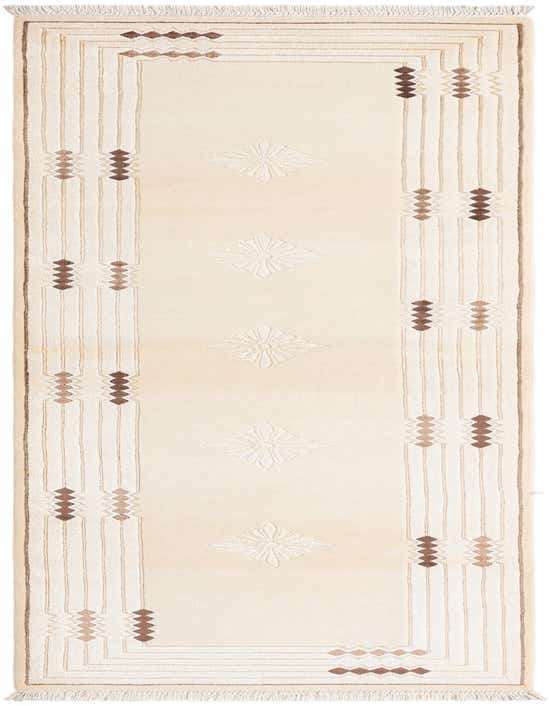 A 10 ft Darya runner rug in ivory and tan, featuring a modern Persian pattern with geometric brown accents and fringed ends, ideal for a hallway.