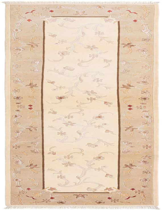 A 10 ft Darya runner rug in brown and ivory, featuring a modern Persian floral pattern with a high pile, perfect for a hallway.
