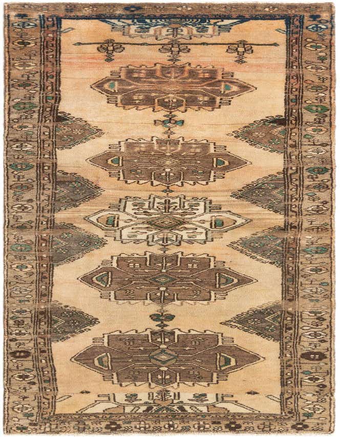 A handmade 8 ft Hamedan runner rug in browns, tans, and ivories, featuring traditional tribal patterns.