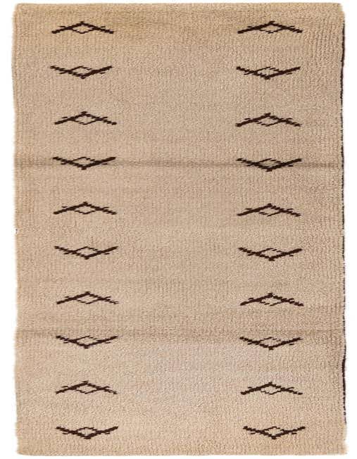 A 12 ft runner rug with a shag pile, featuring a cream background and brown tribal patterns, ideal for a hallway.