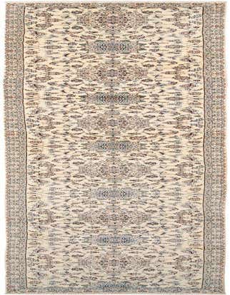 A 20 ft handmade wool runner rug in ivory and cream with a traditional floral medallion pattern and brown and blue accents, ideal for a hallway.