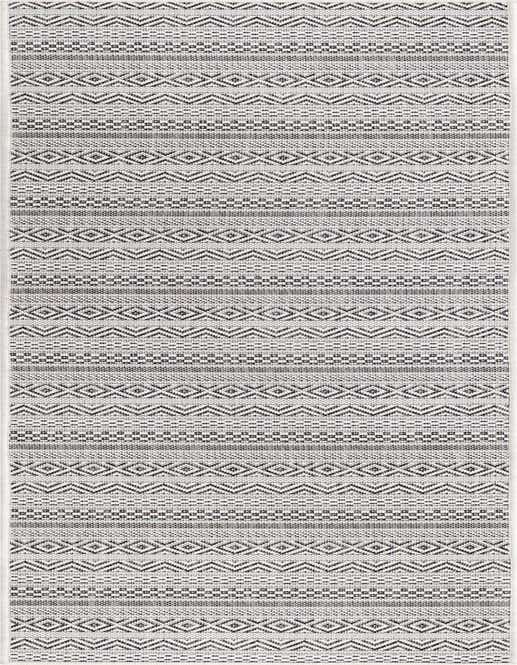 An 8 ft runner rug with a tribal pattern in shades of brown and ivory, suitable for indoor/outdoor use.