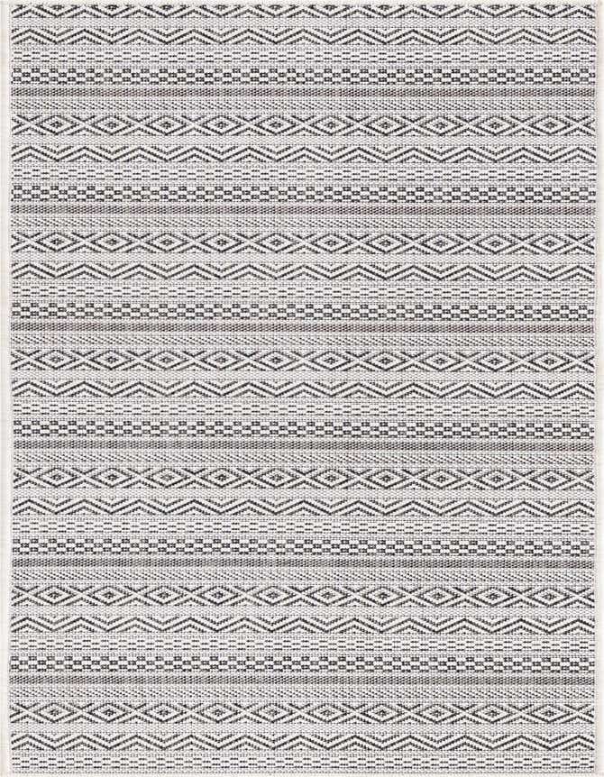 A 6 ft runner rug with a tribal pattern in shades of brown and ivory, suitable for indoor/outdoor use.