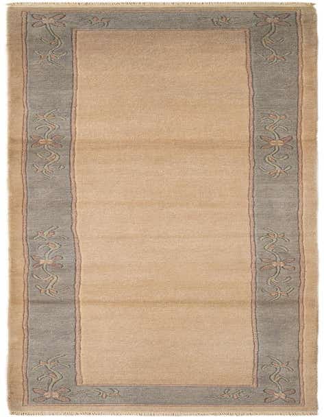 A long 11 ft runner rug in tan with a gray border featuring delicate floral patterns in pink and green, ideal for a hallway.