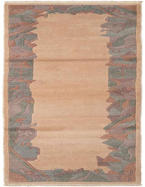 An 11 Ft runner rug in brown and ivory with an abstract, modern border pattern in muted green, purple, and rust.