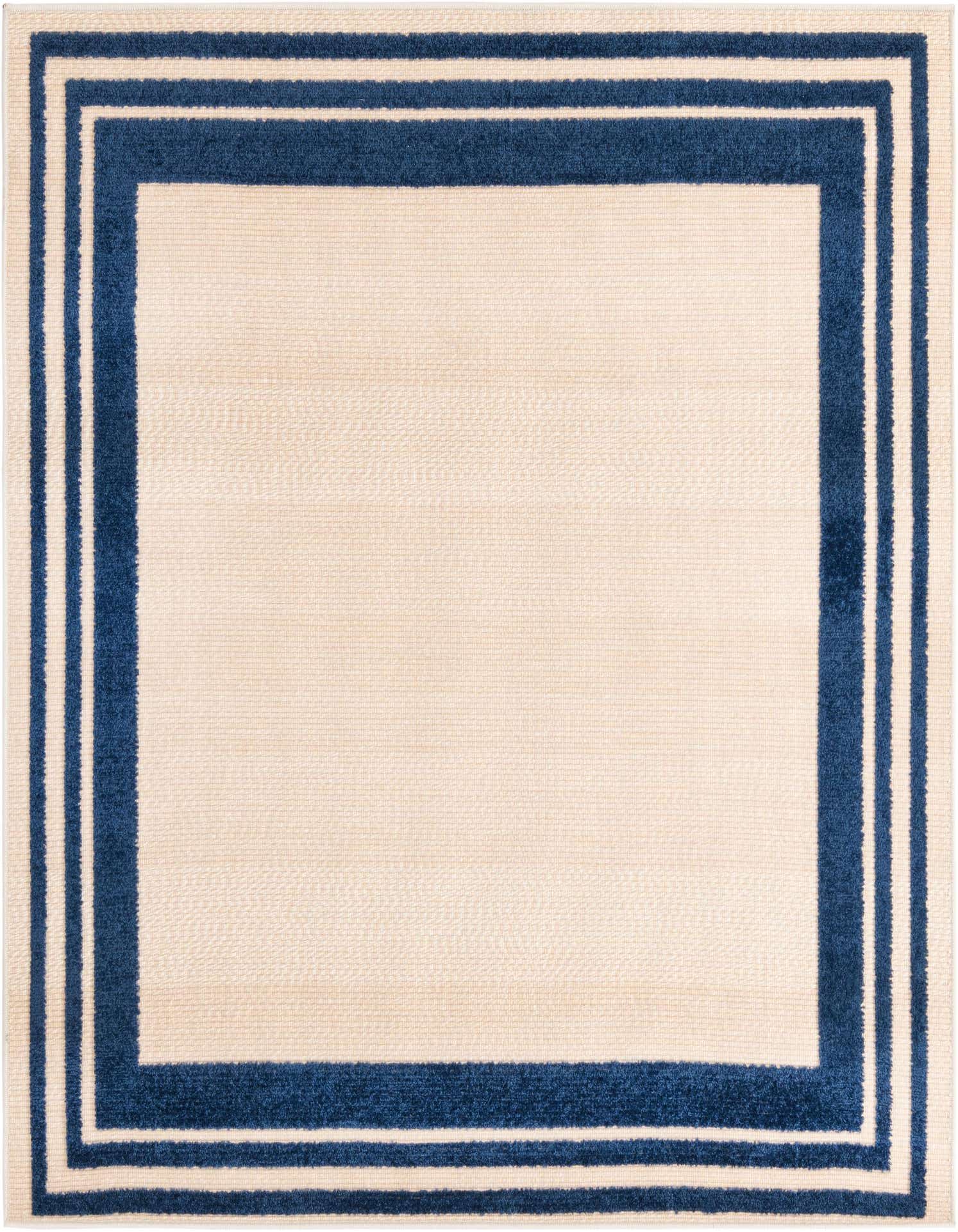 A 5'3" x 5'3" square Rugs.com Aruba Outdoor rug in cream with a bold navy blue border, ideal for a patio.