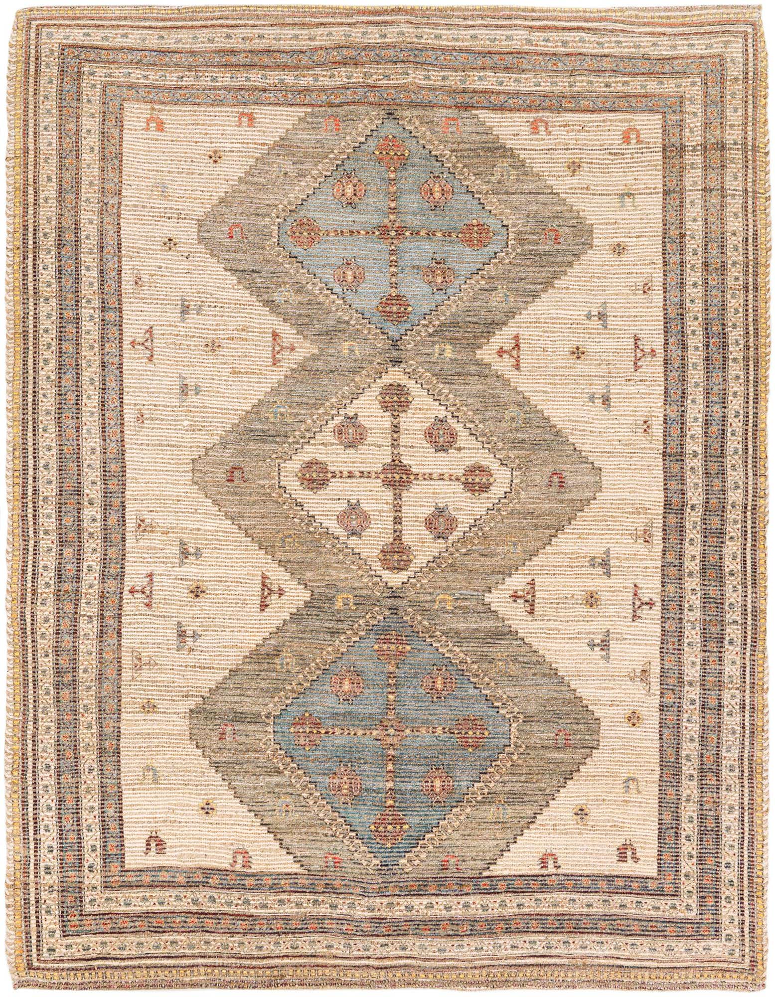 A square Chenille Jute rug featuring a modern pattern with large brown and ivory diamonds, accented by blue and red motifs.