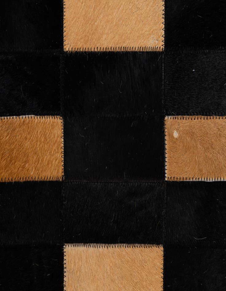 Detail image of  5' 1 x 7' 11 Cowhide - Patchwork Rug