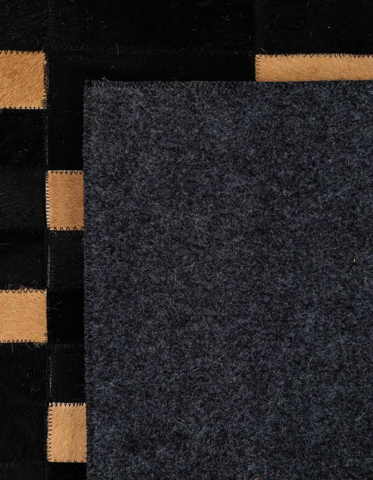 Detail image of  5' 1 x 7' 11 Cowhide - Patchwork Rug