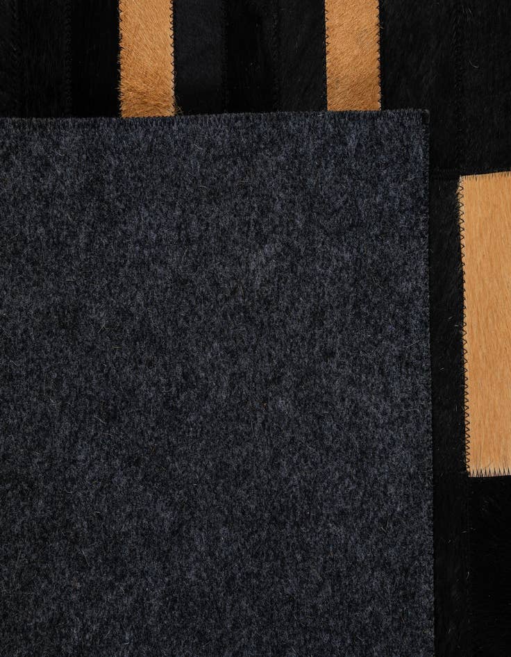 Detail image of  5' 1 x 7' 11 Cowhide - Patchwork Rug