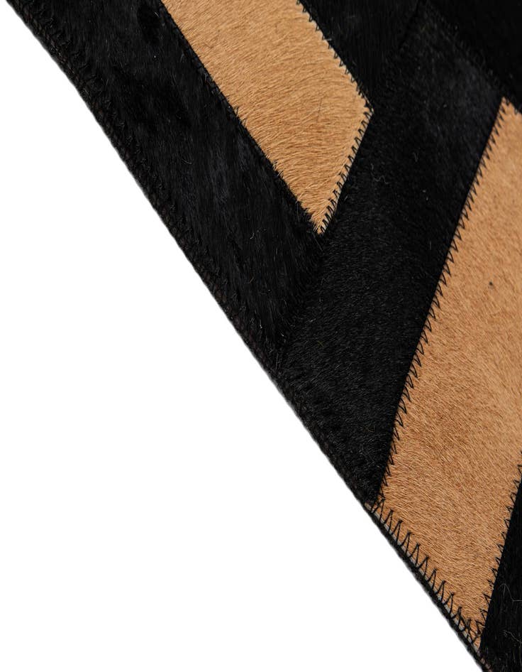 Detail image of  5' 1 x 7' 11 Cowhide - Patchwork Rug