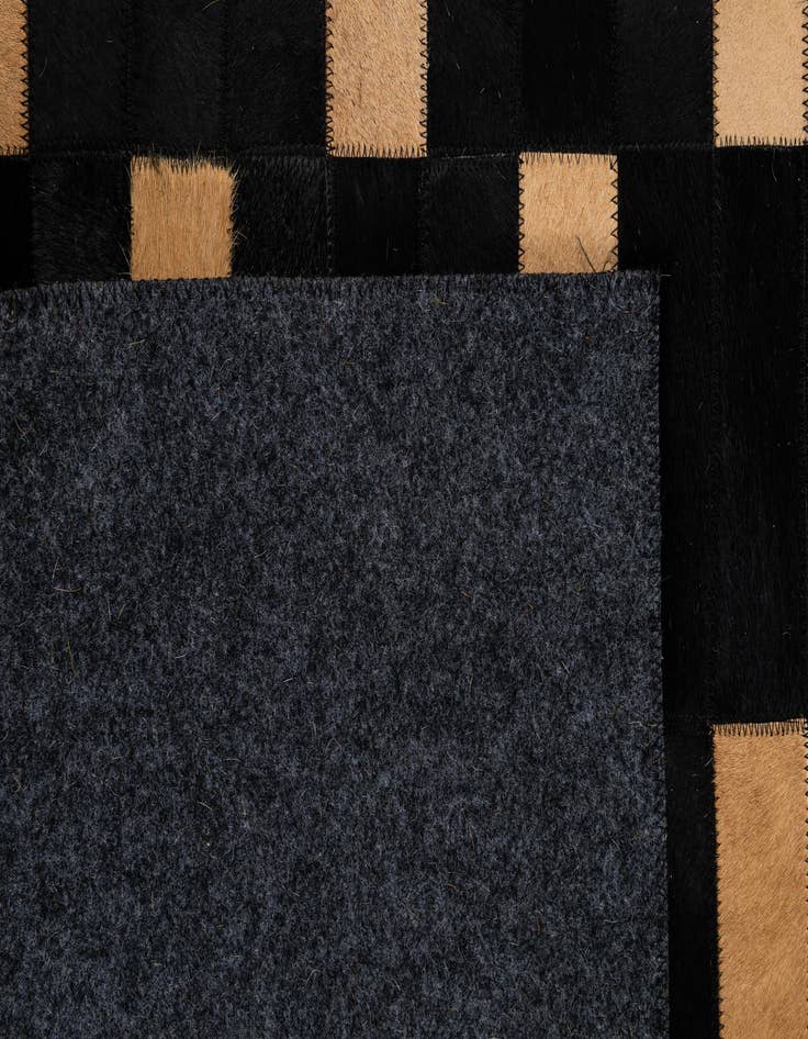 Detail image of  5' 1 x 7' 11 Cowhide - Patchwork Rug