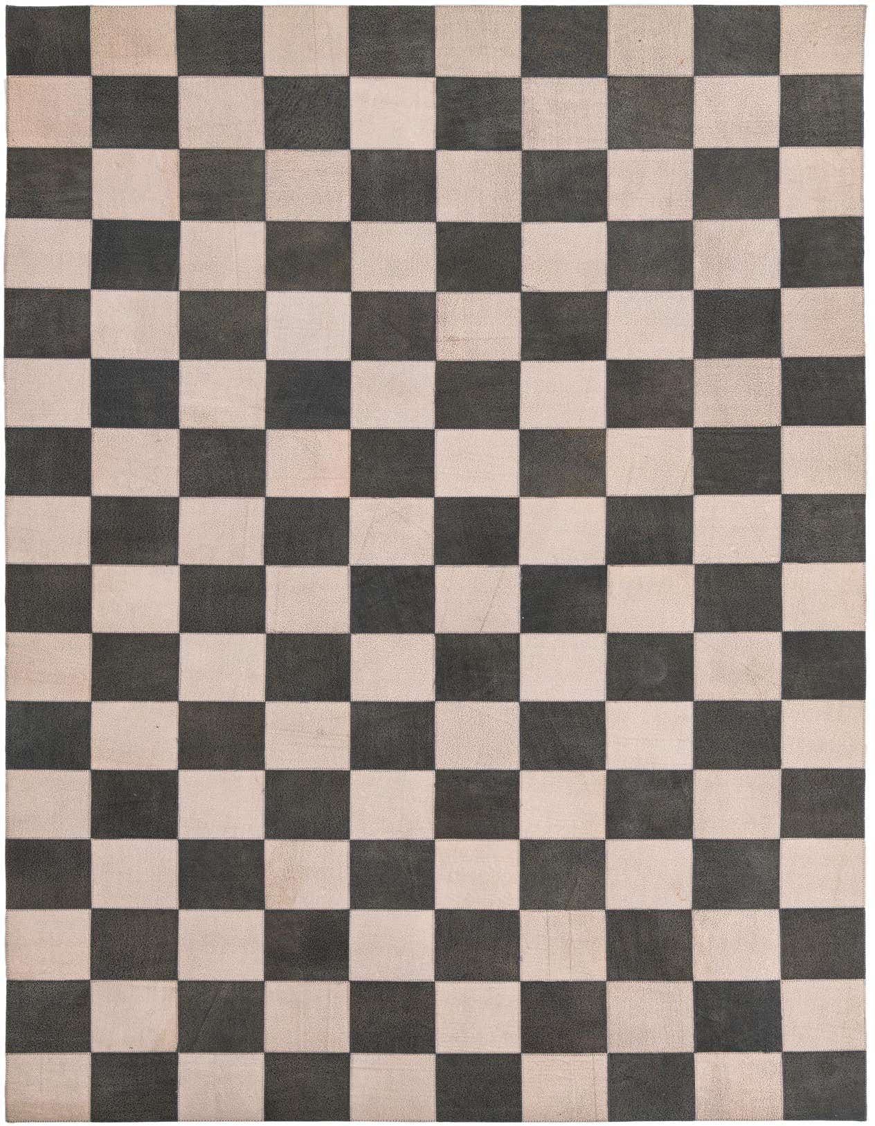 A 5x8 rectangular black and white checkered rug made from cowhide and leather, ideal for a living room.