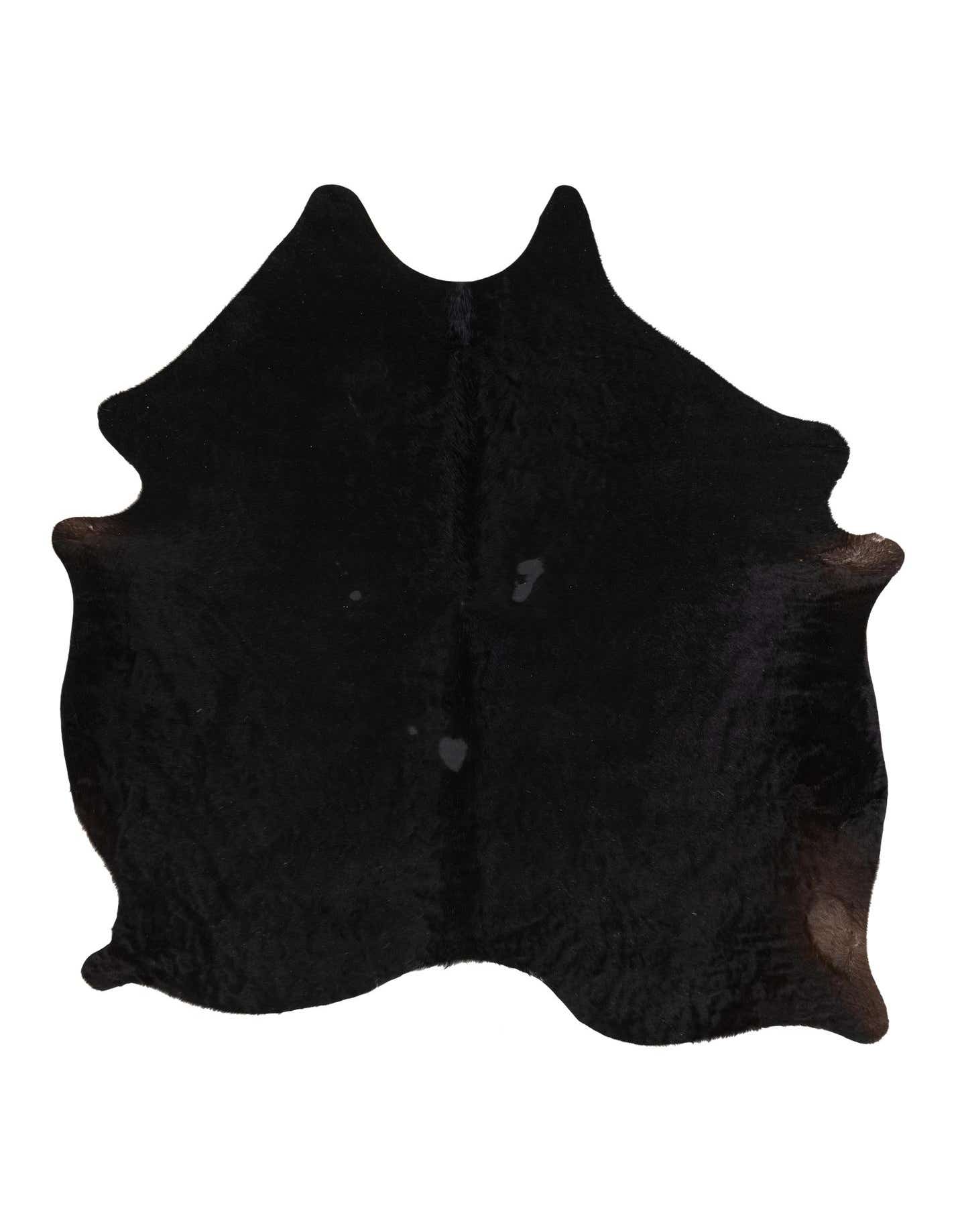 A 5x8 rectangular black and brown cowhide rug with a natural, irregular shape, suitable for a modern living room.