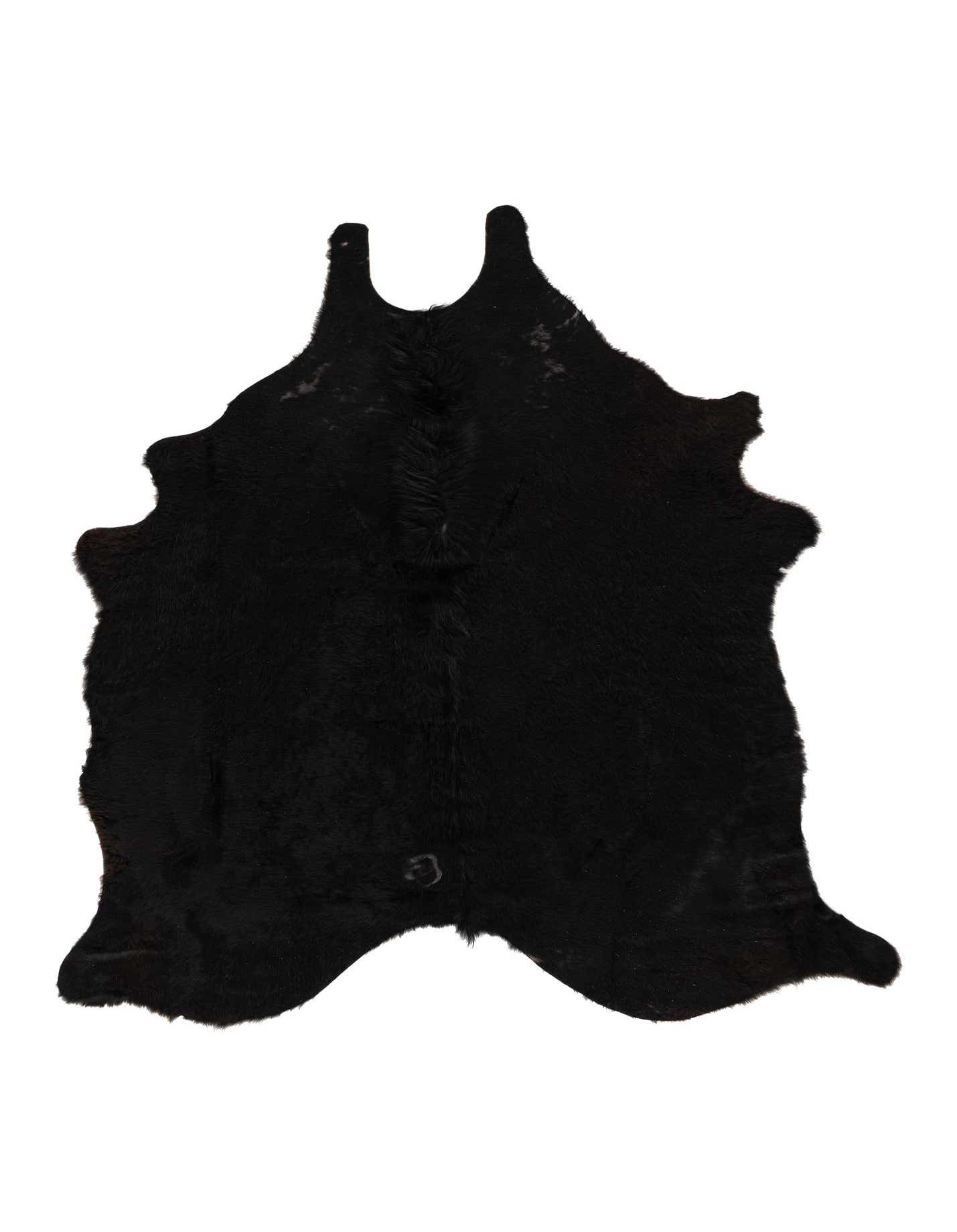 A 5x7 black cowhide leather rug with a natural, irregular shape, showcasing its textured, flat pile.