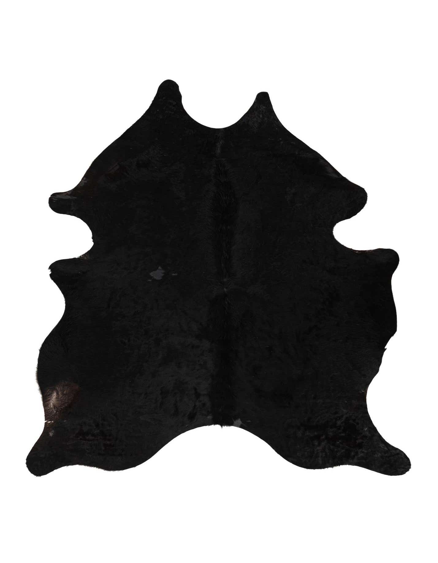 A 5x8 rectangular black cowhide rug with a natural, irregular shape and textured pile, suitable for a modern living room.