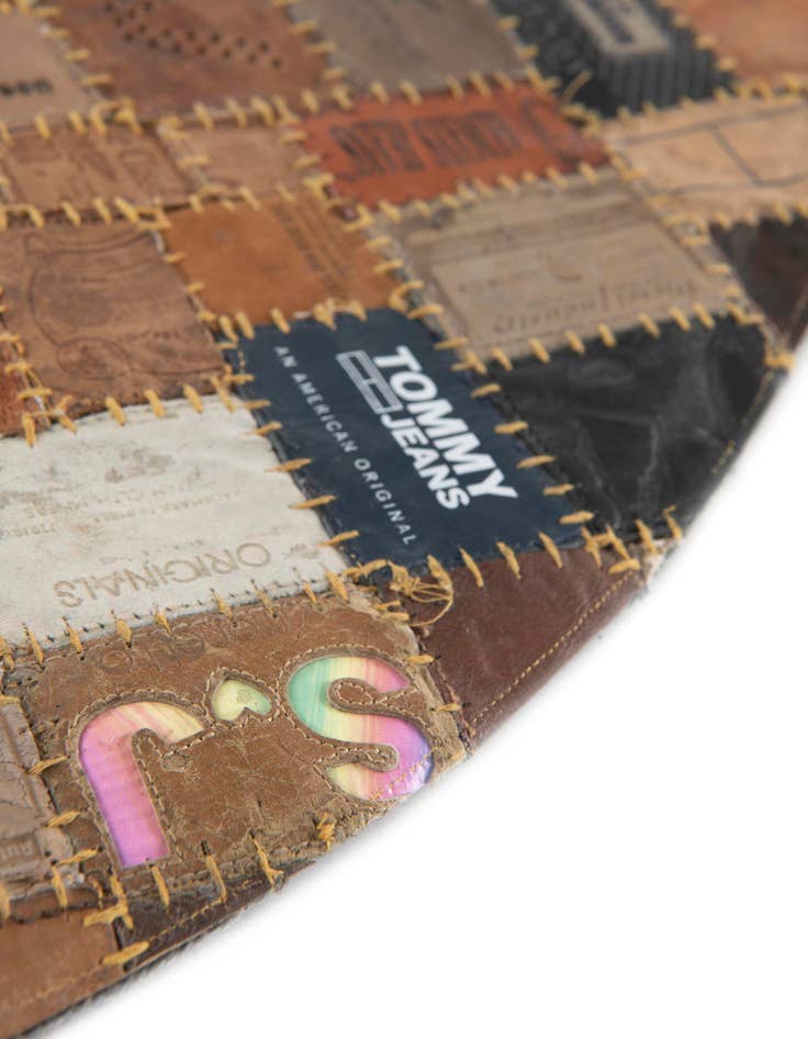 Detail image of  3' 1 x 3' 1 Jean Leather Tag Round Rug