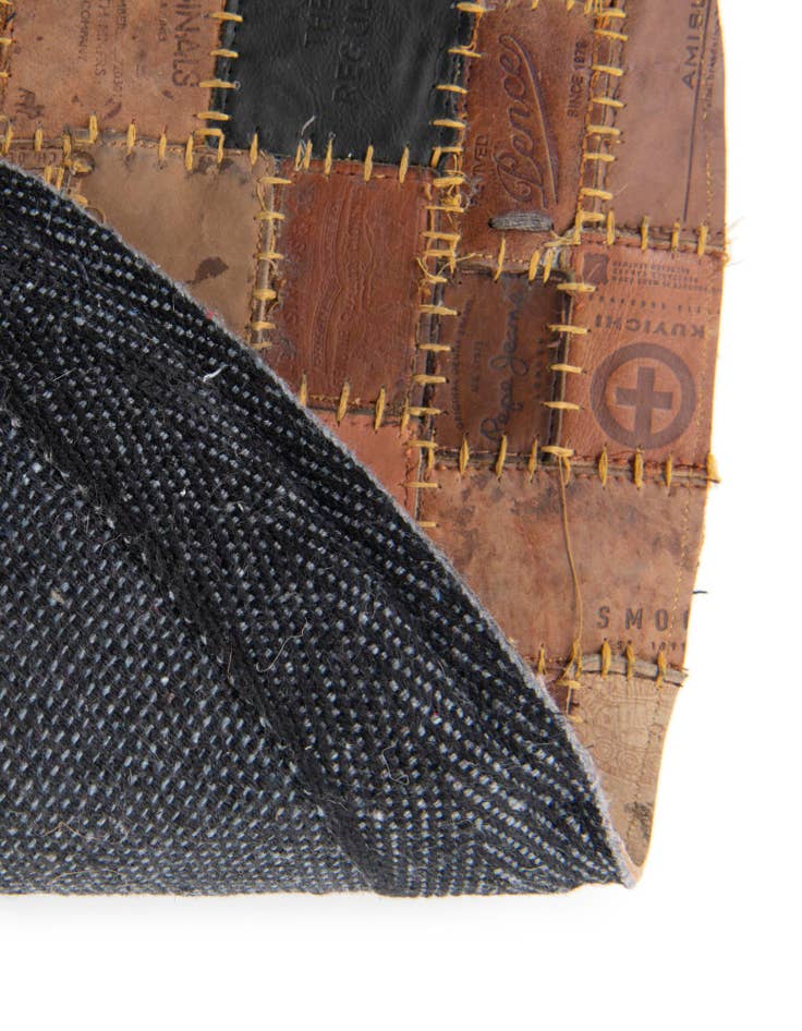 Detail image of  3' 1 x 3' 1 Jean Leather Tag Round Rug