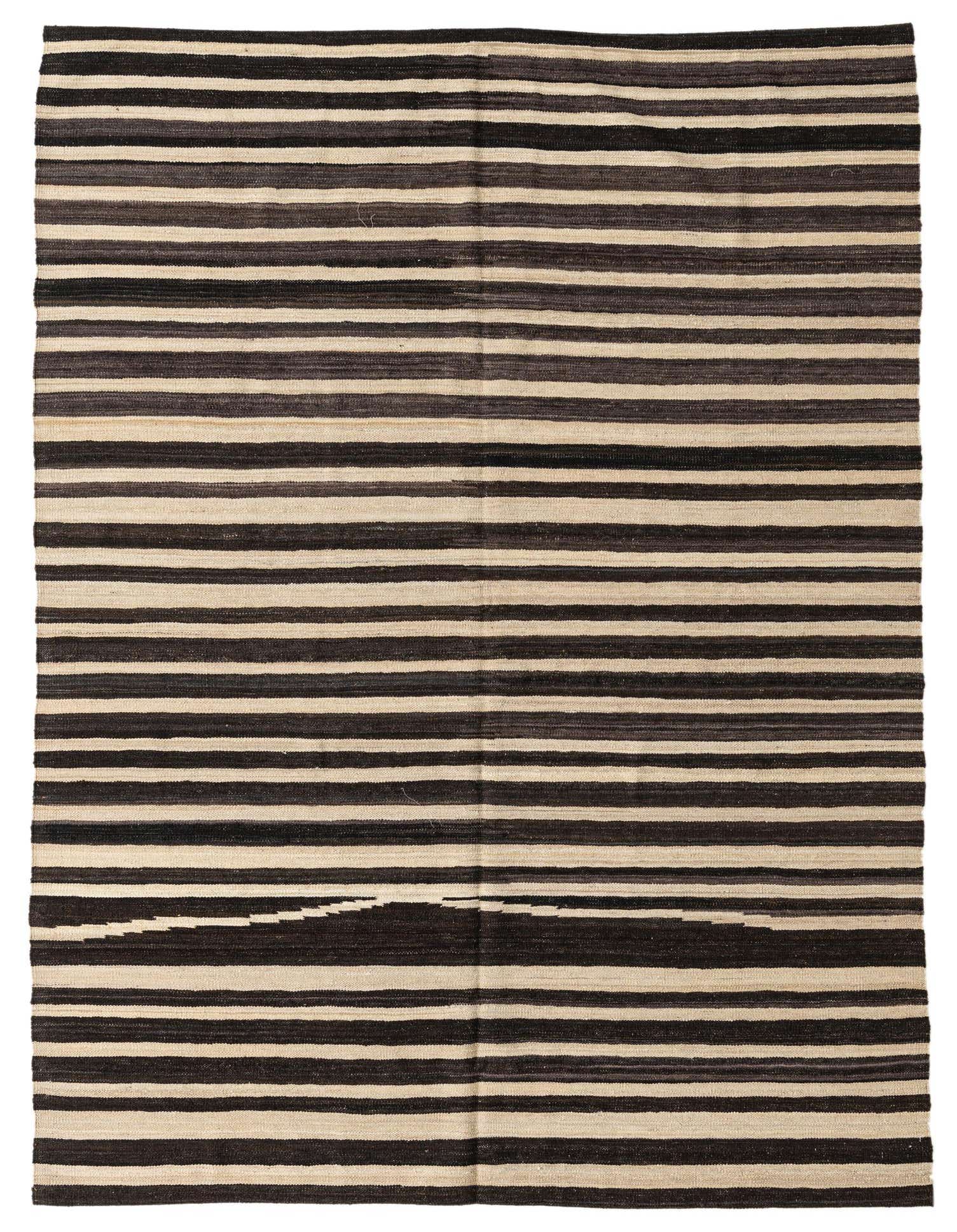 A 5x8 rectangular black and ivory striped flatweave rug with a subtle tribal pattern, suitable for a living room.
