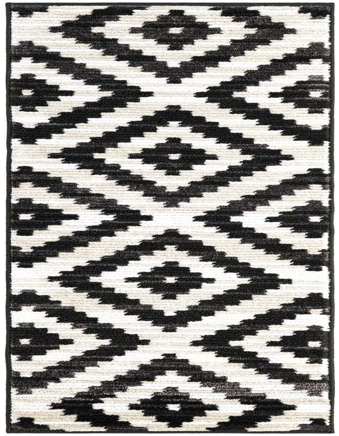 A 6 ft runner rug with a bold black and ivory modern geometric diamond pattern, featuring a textured pile.