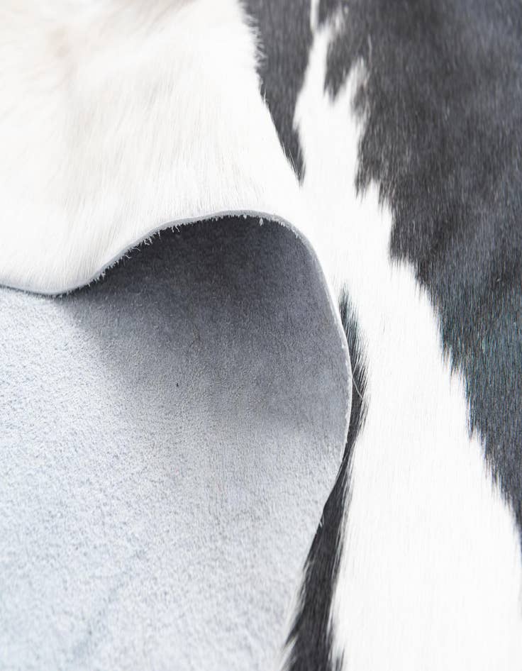 Detail image of  6' 10 x 7' 8 Cowhide Freeform Rug