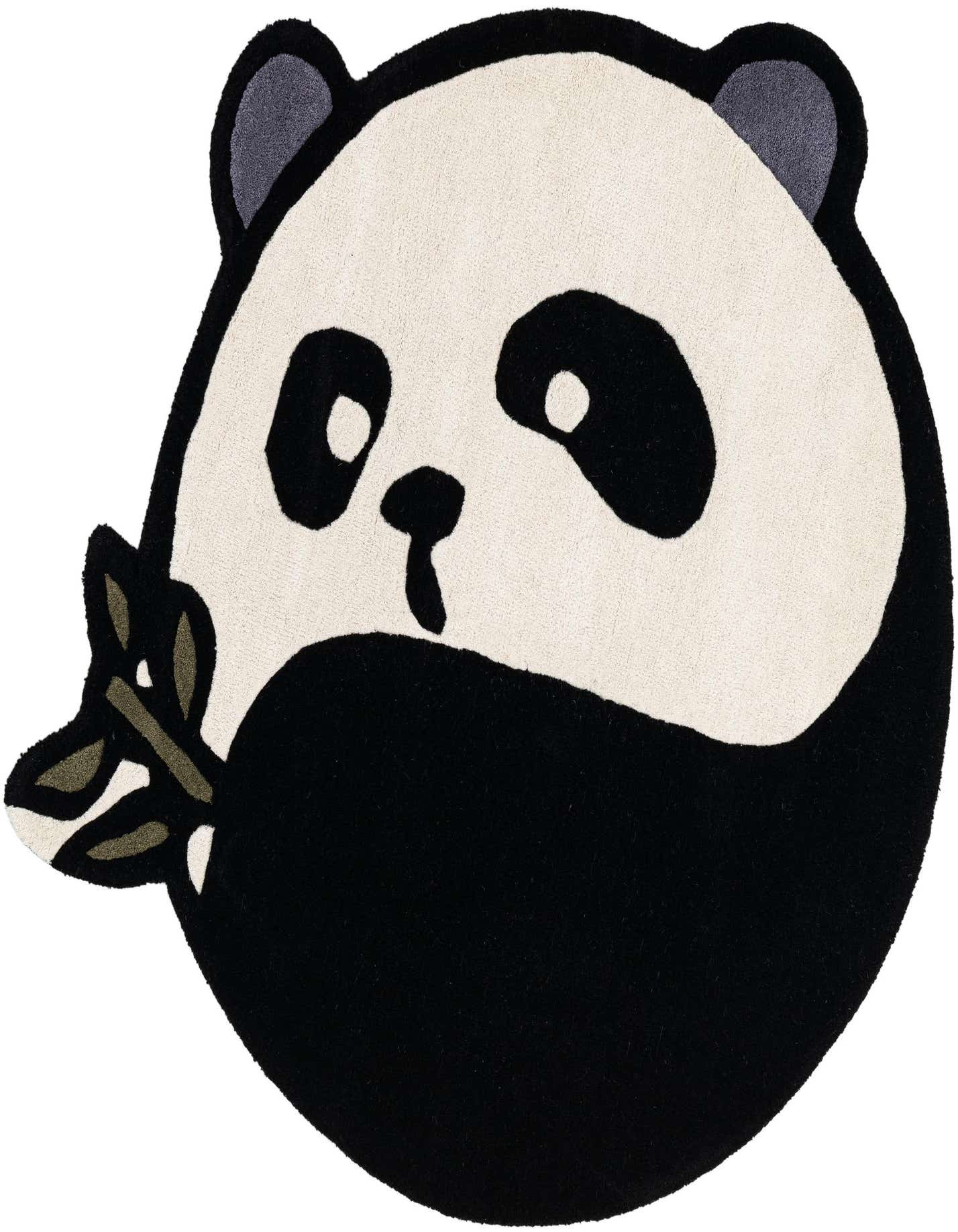 A black and white freeform panda bear rug with a high pile, holding a green bamboo branch.