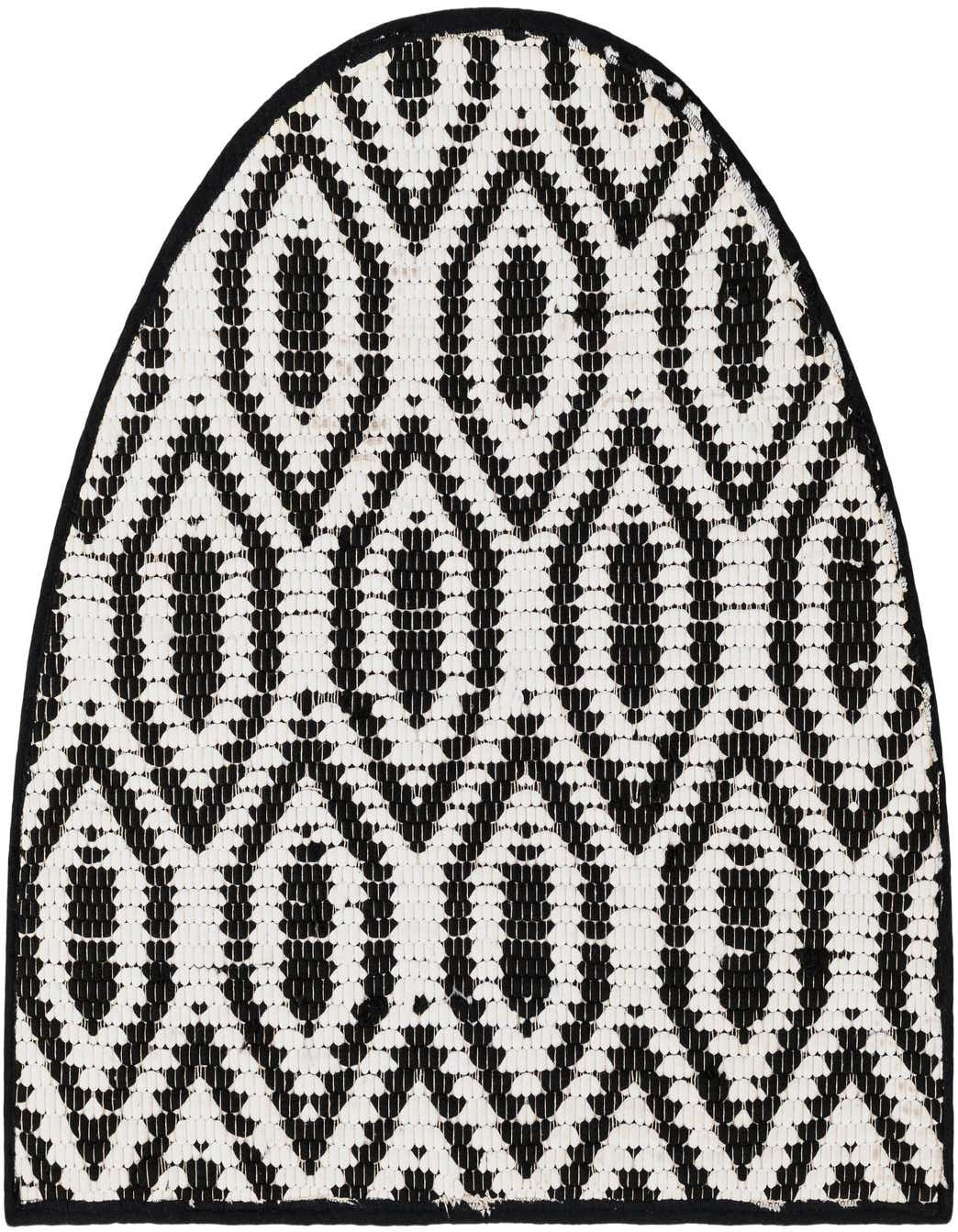 A 2' 2 x 3' 7 hearth rug with a black and white geometric pattern, featuring a textured flatweave.