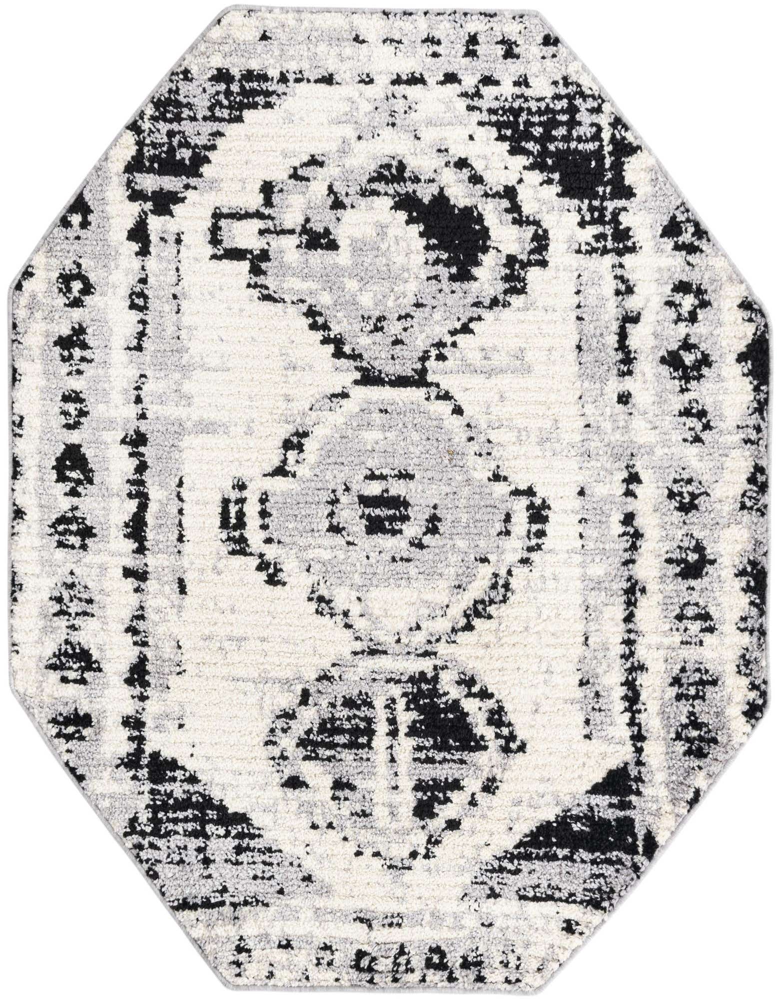 An octagon-shaped Rugs.com Tagine rug, 5'3" x 5'3", featuring a distressed black and ivory Southwestern pattern.